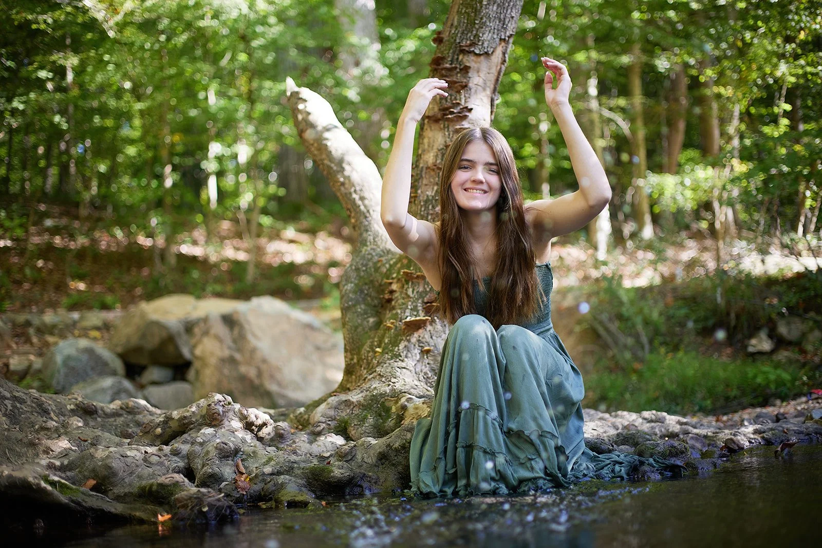 senior photos splashing in water.jpg