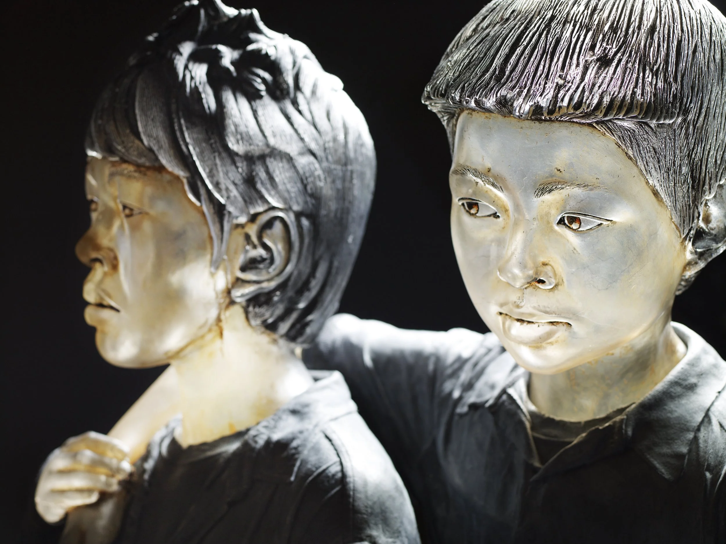 Shan Boys | Blown and Cast Glass, Oil Paint, Cement | 20" H X 27" W x 14" D | 2010