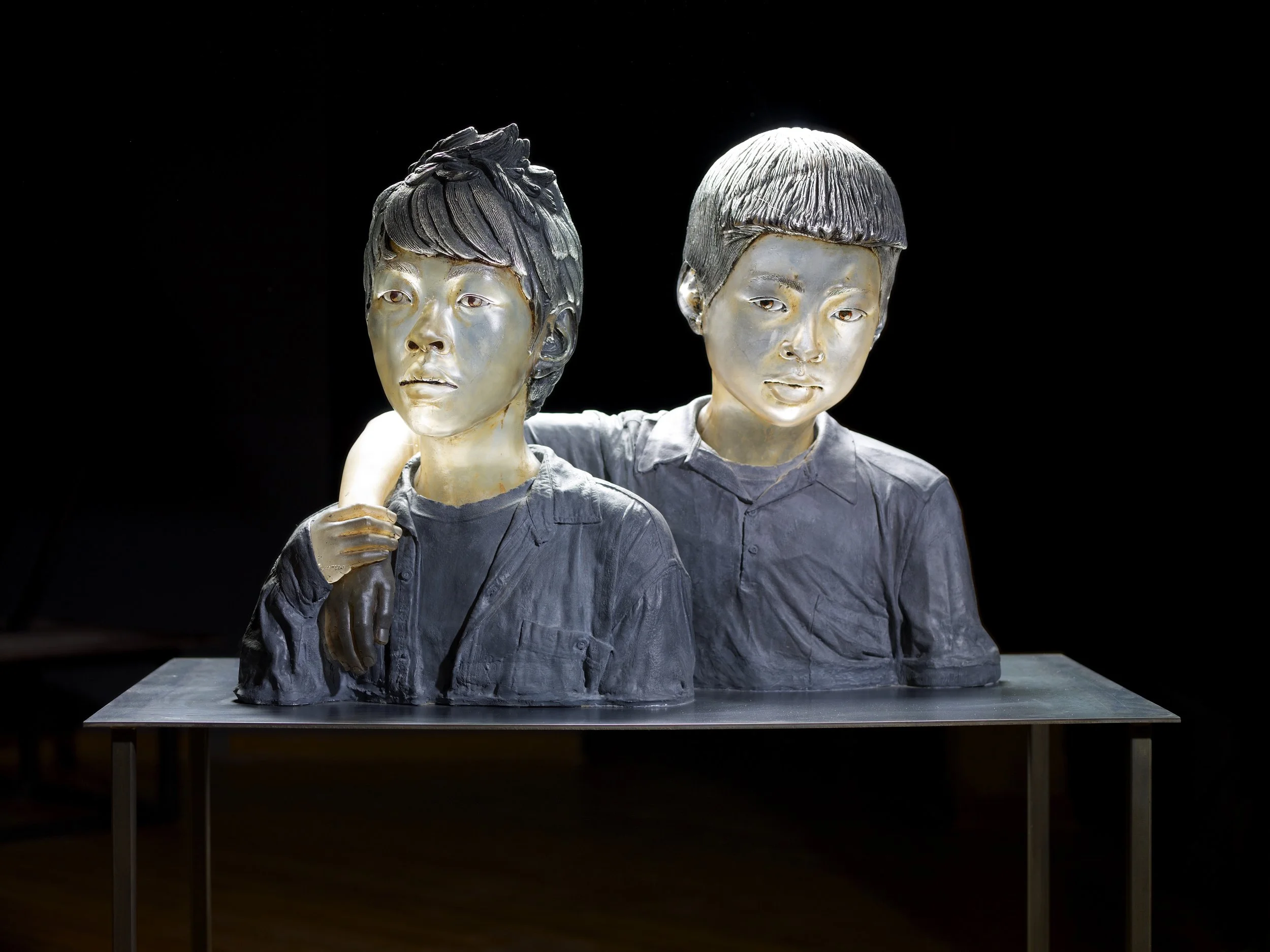 Shan Boys | Blown and Cast Glass, Oil Paint, Cement | 20" H X 27" W x 14" D | 2010