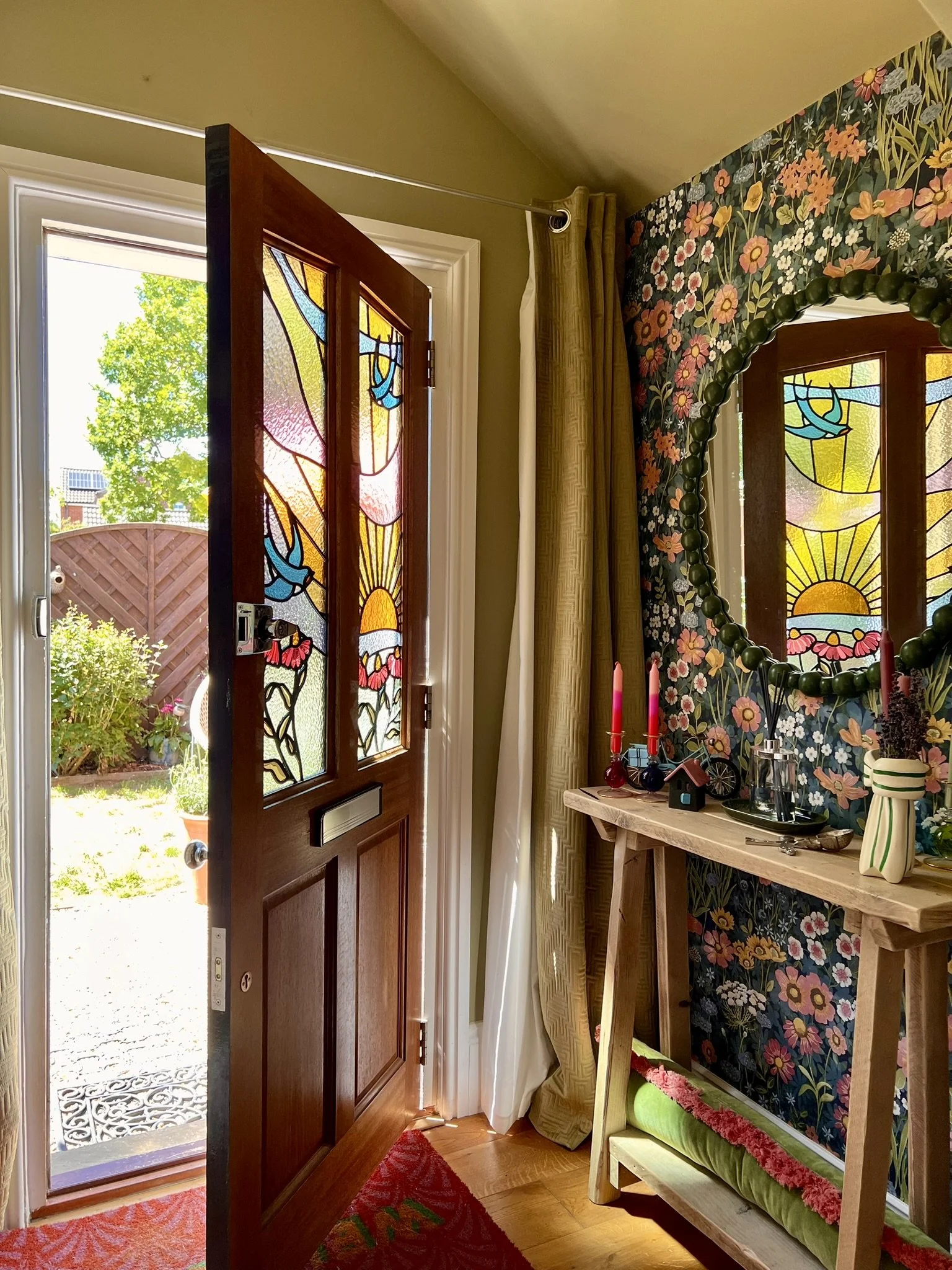 maximalist stained glass front door set featuring swallows, a sunset and fuchsia pink cone flowers