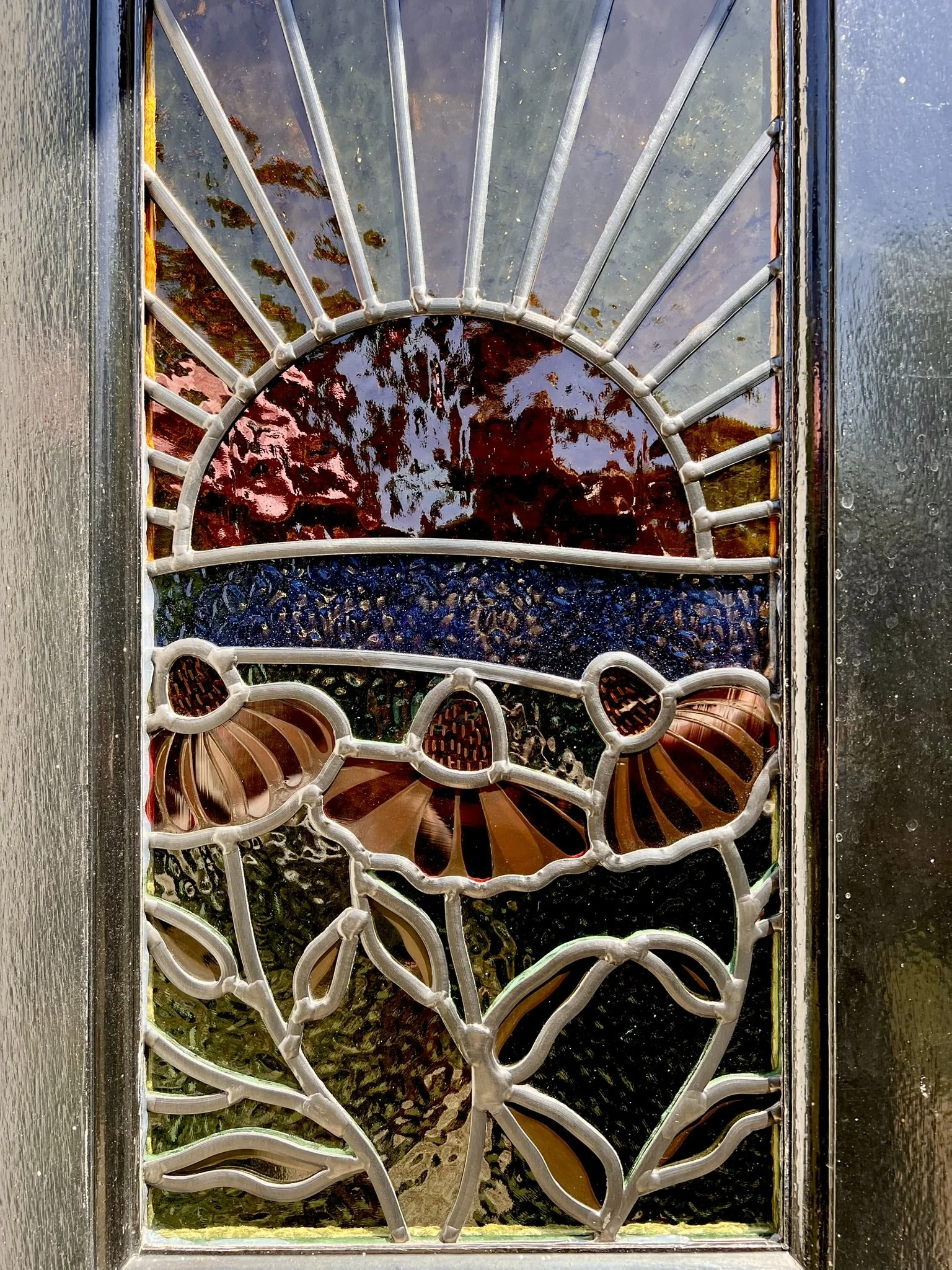 maximalist stained glass front door set featuring swallows, a sunset and fuchsia pink cone flowers