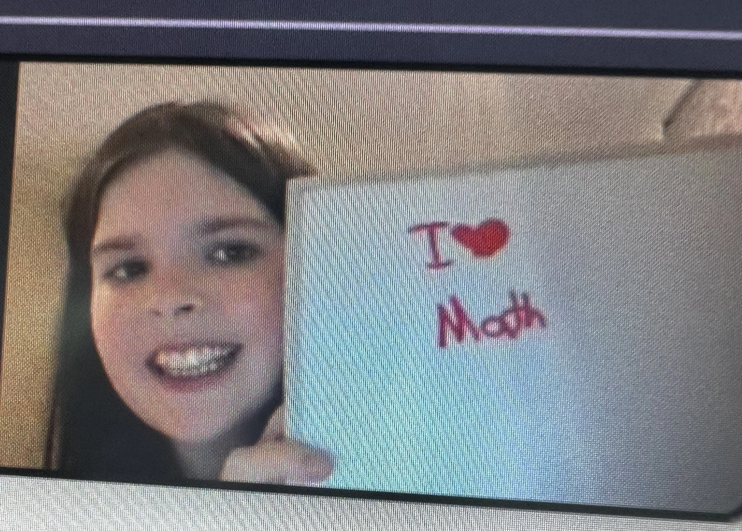 girl holding sign saying "I love math"