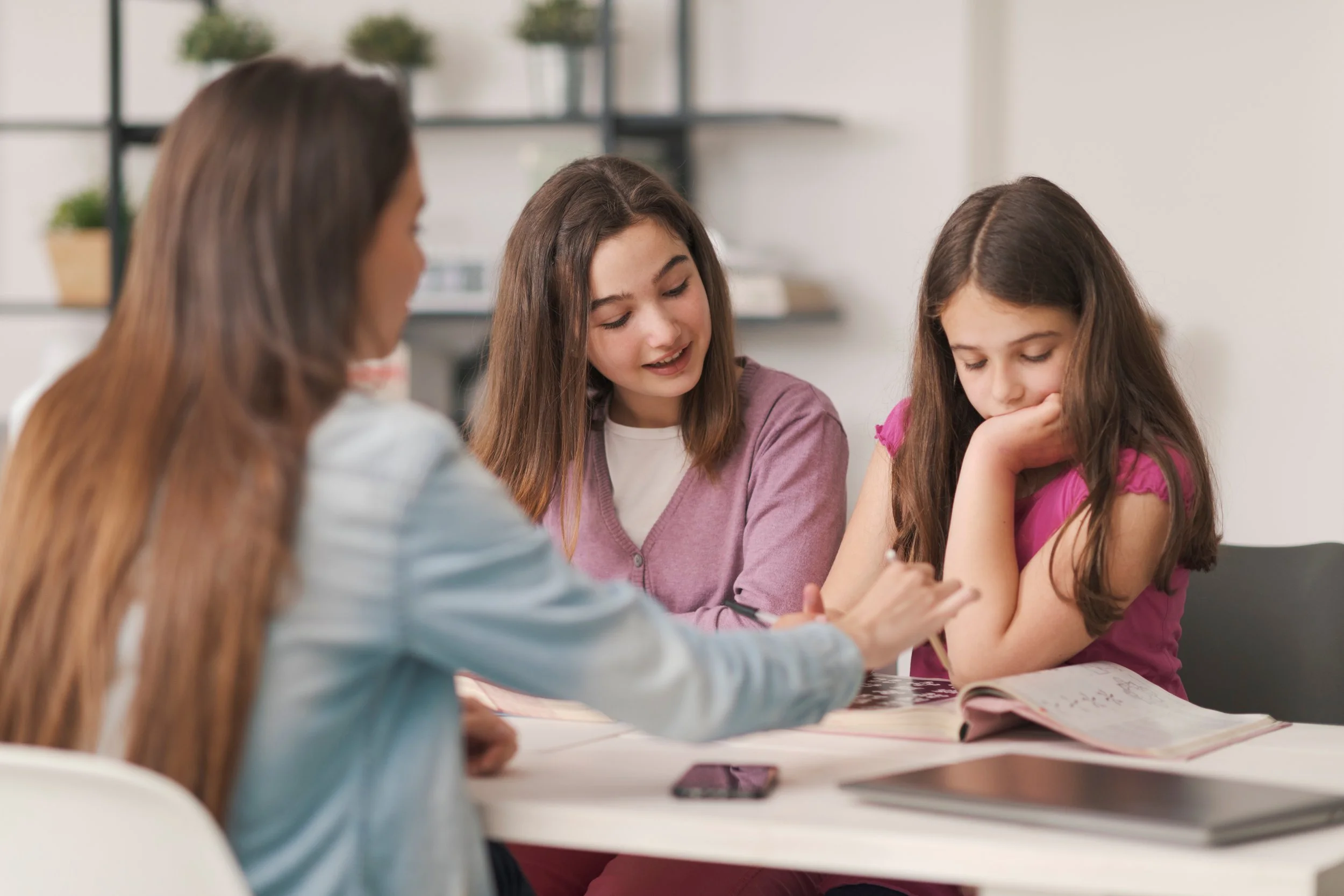 mother helping kids with homework