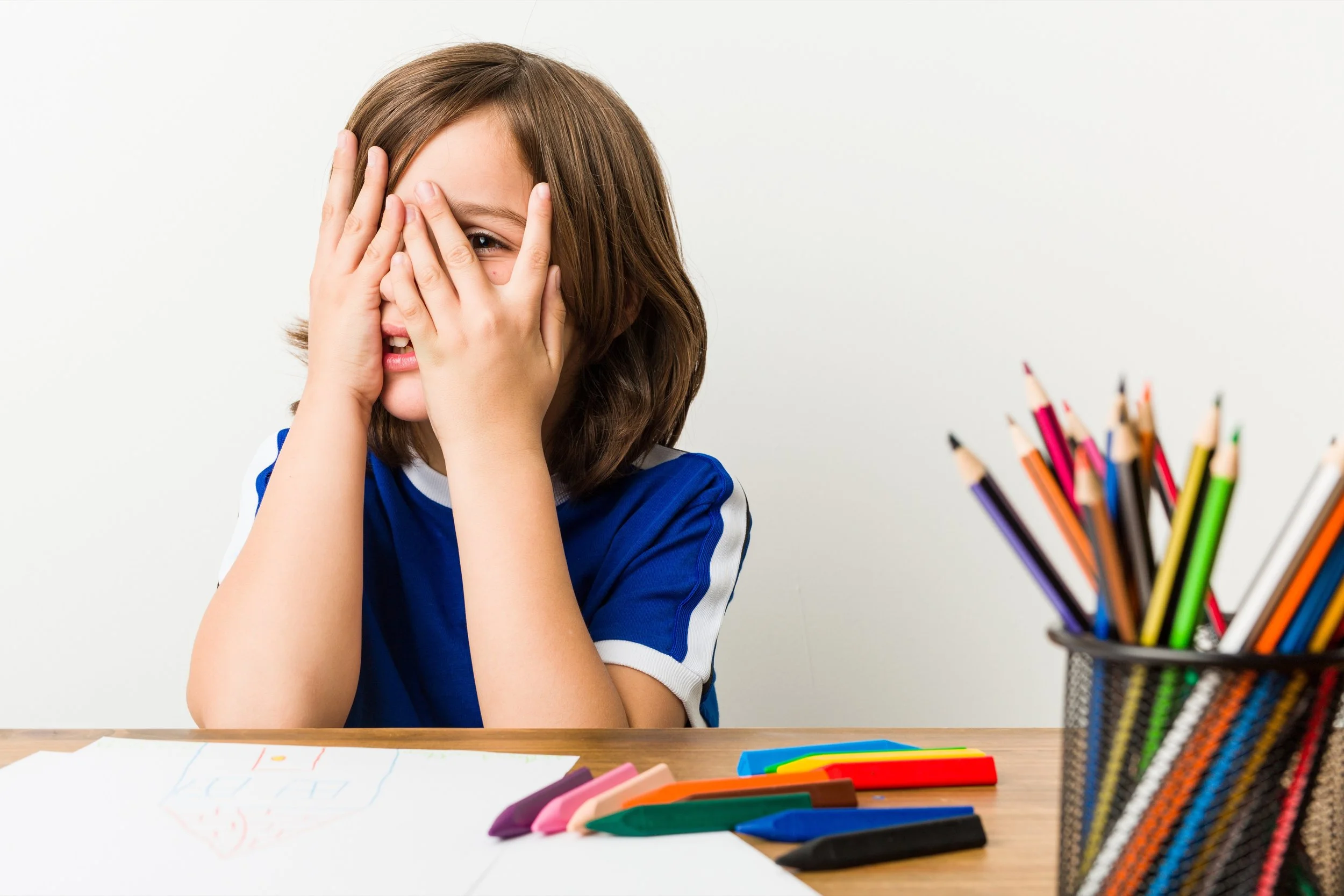 worried child at desk