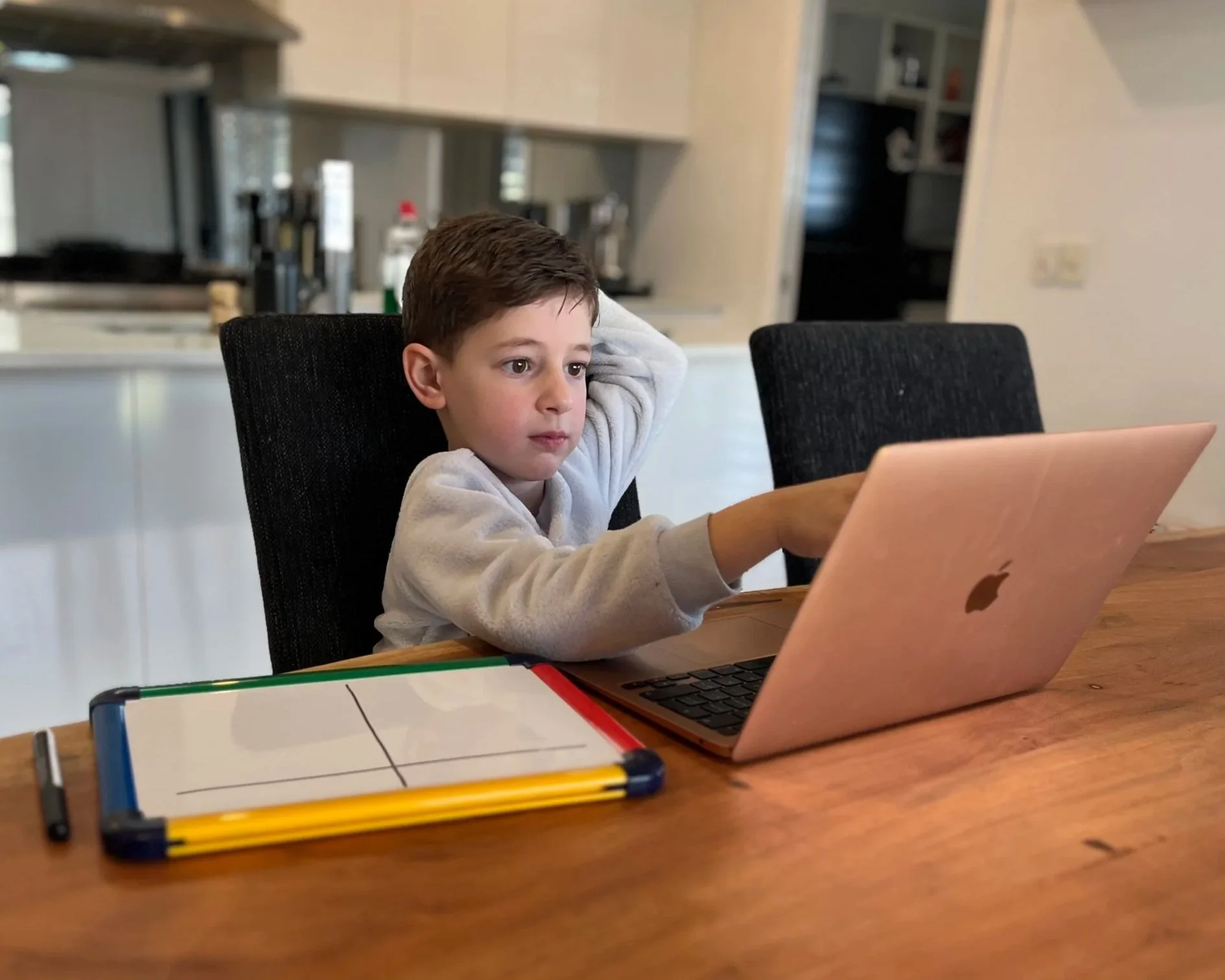 child working with tutor