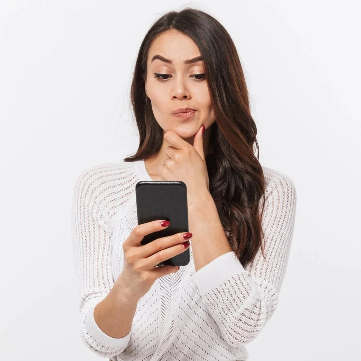 thoughtful woman reading smartphone