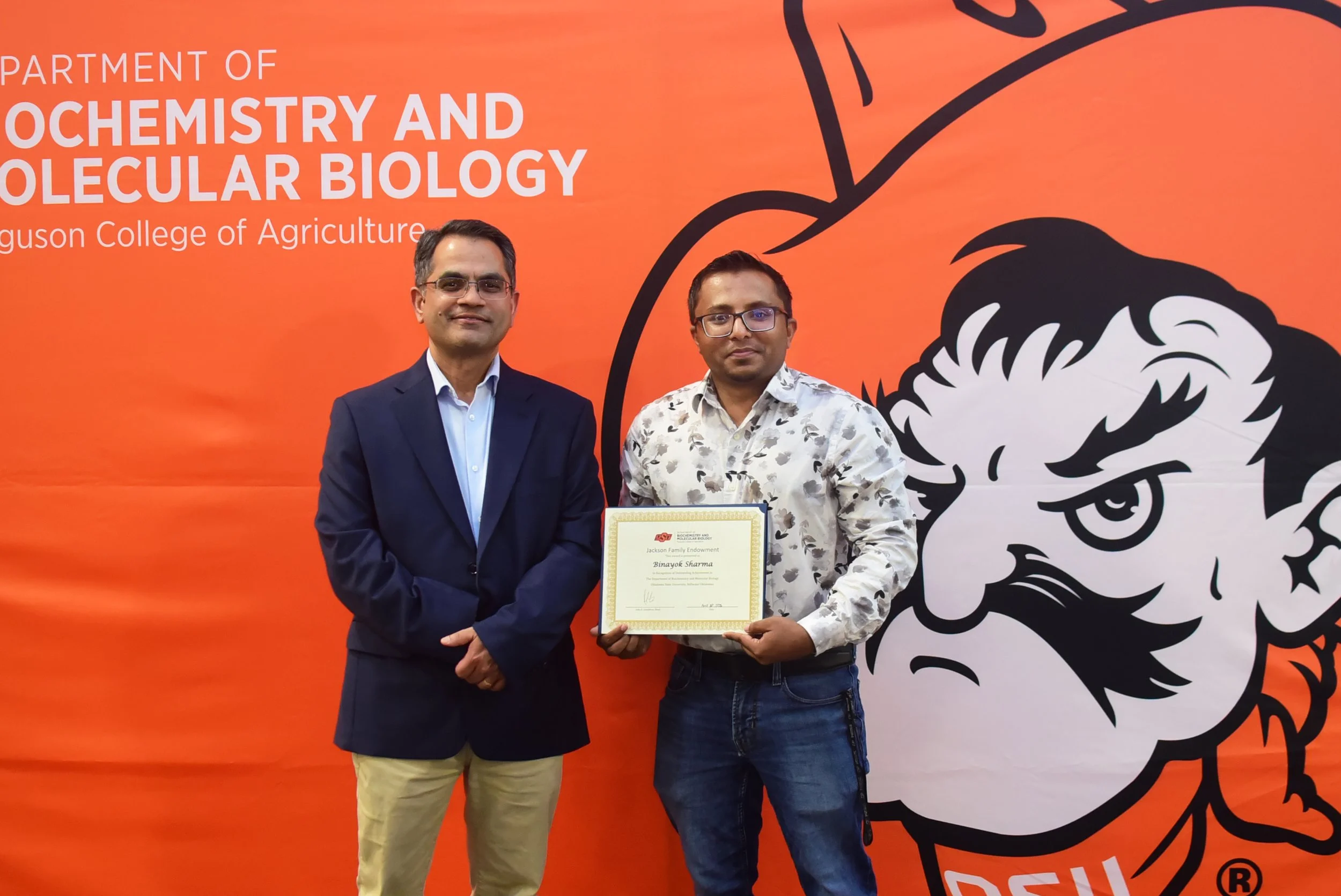 Binayok Sharma receiving the received the Jackson Family Endowment Award in recognition of outstanding achievement in the Department of Biochemistry and Molecular Biology at OSU
