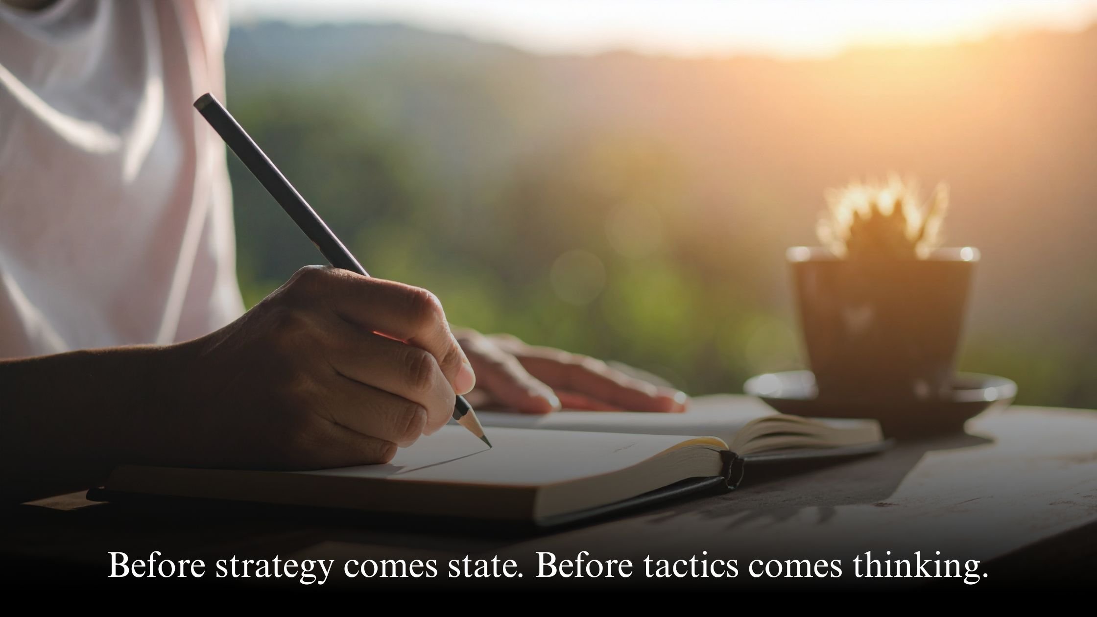 Woman journaling about business strategy and mindset development