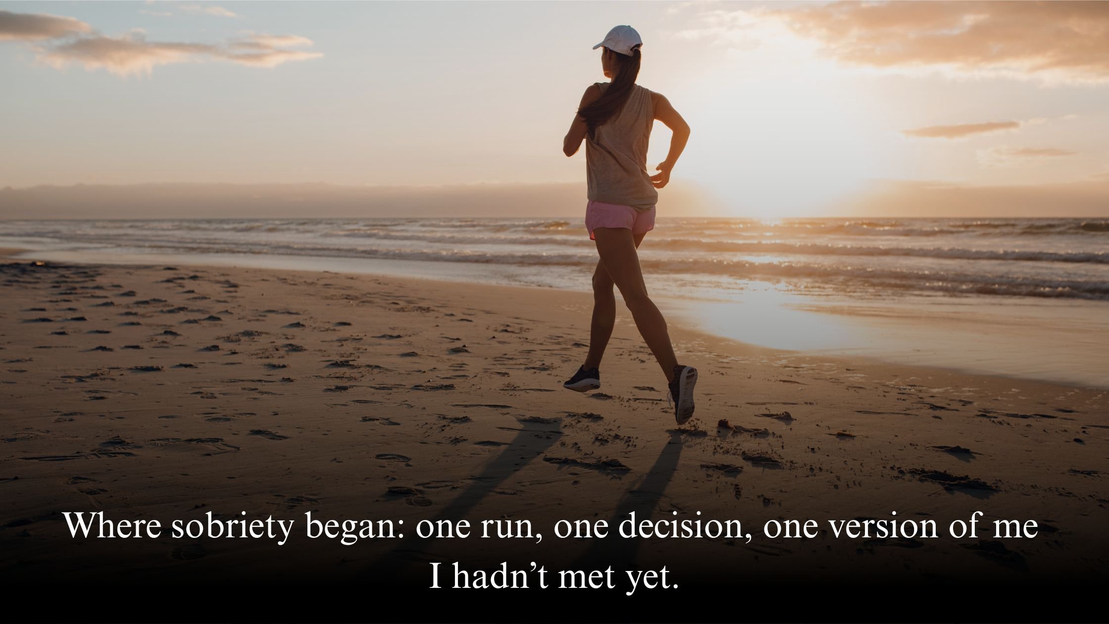 Runner on Brighton seafront at sunrise, symbolising the beginning of Jo Renshaw’s sober journey through marathon training.