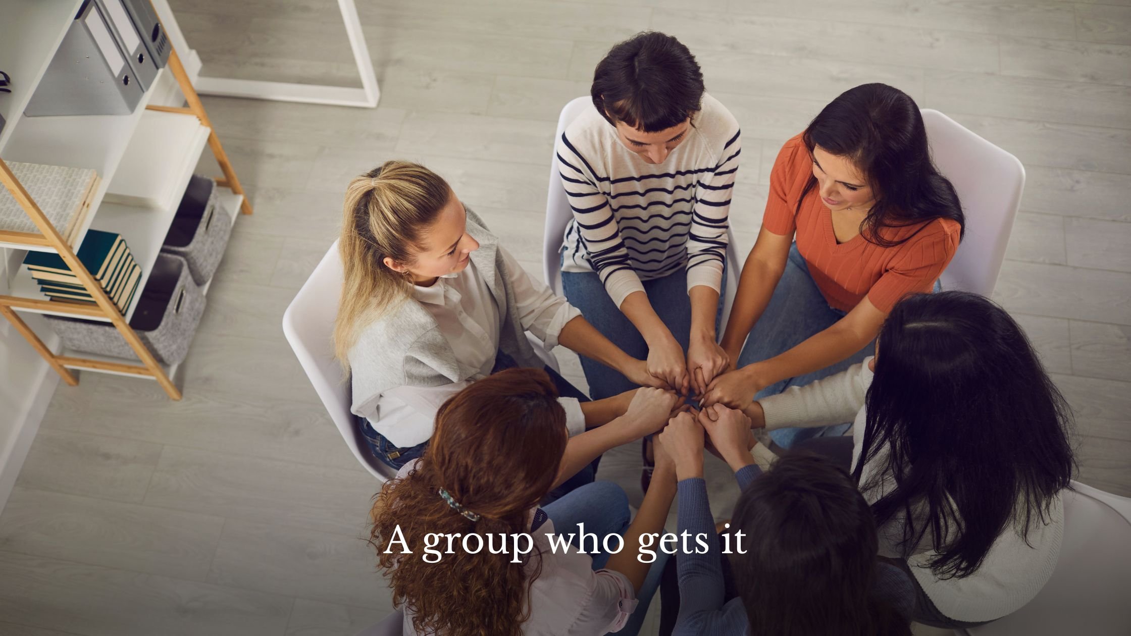 Small group of women in a warm coaching circle, supporting each other