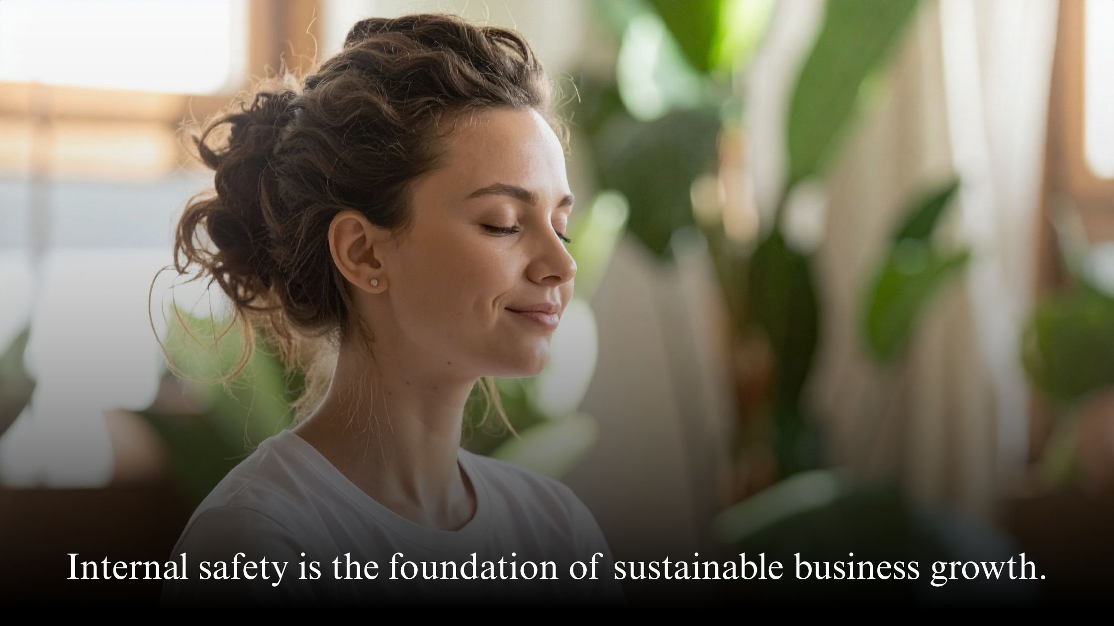 Female business leader practicing emotional regulation and internal safety