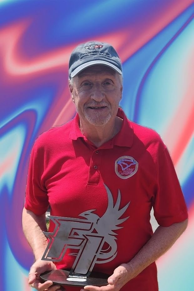 Mike holding the trophy he received for the Best Chevrolet at the Fountain Inn High School car show in the spring 2024