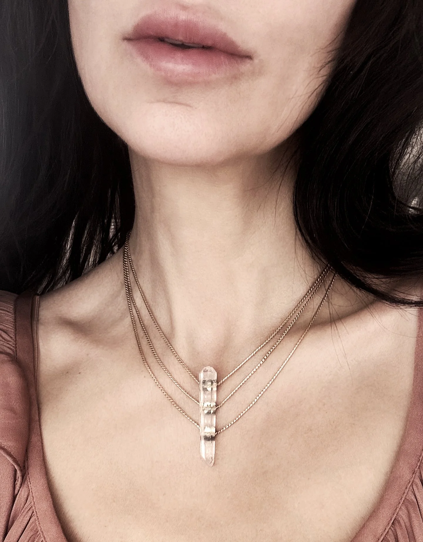 Ripple-armed with ardor-quartz crystal necklace-on.jpeg