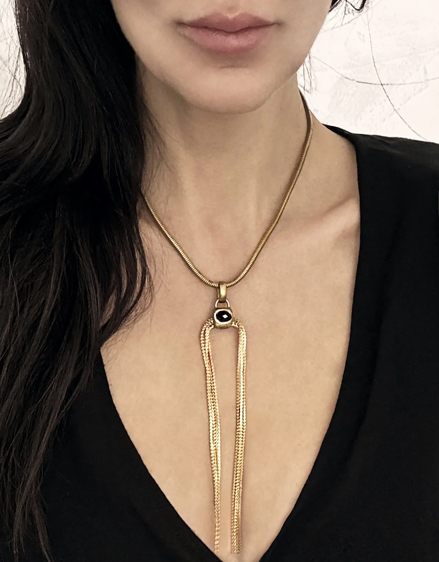Nix-armed with ardor-garnet and chain tassel  necklace-on.jpeg