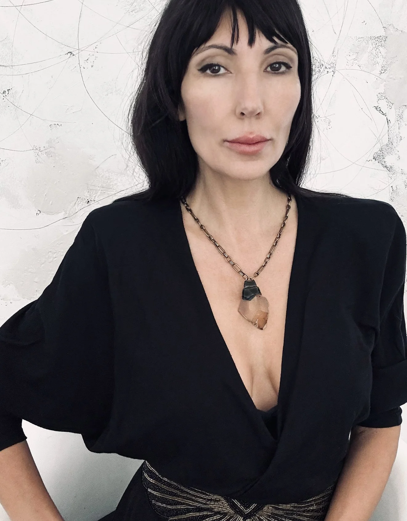 Ikon-armed with ardor-geometric smoky quartz necklace-on.jpg