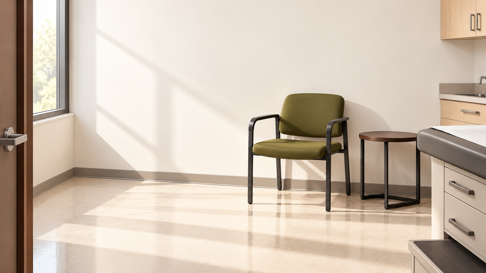 An empty chair sits in a quiet medical exam room.