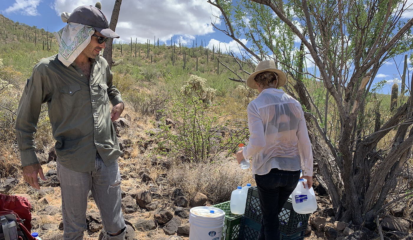  Scott Warren and Emily Saunders leave water in the Arizona desert.  Photo Credit: Jude Joffe-Block 