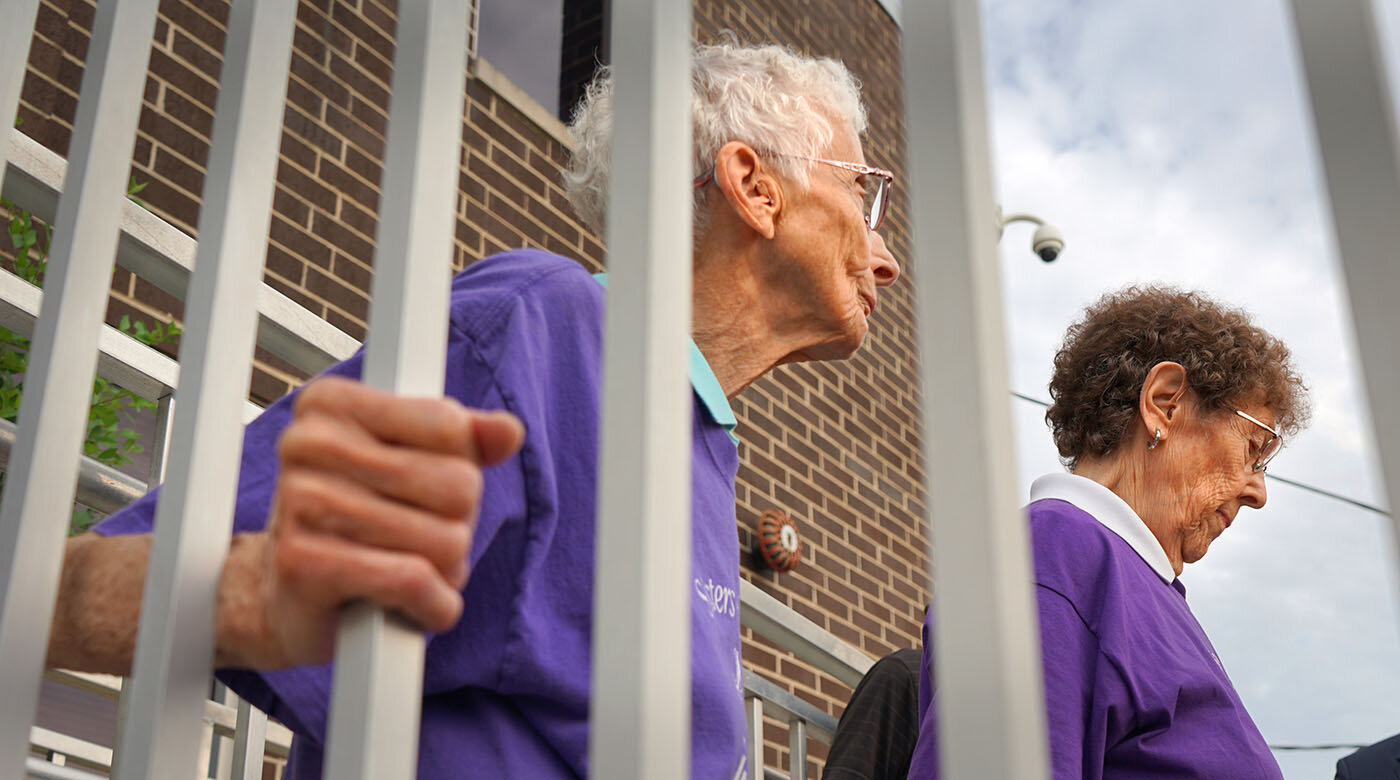  Sisters Joann Persch and Pat Murphy would board the buses weekly at the Broadview Processing Center to pray with detainees who were being deported from the US.  Photo Credit: Heidi Shin 
