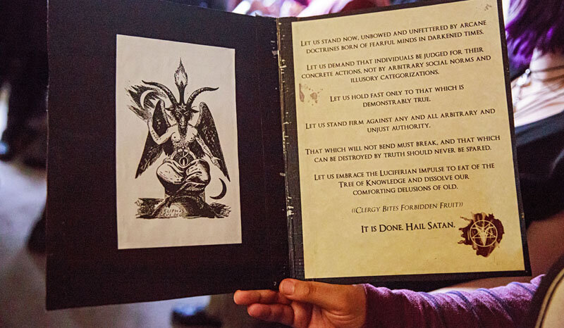  The Satanic Invocation read by members of The Satanic Temple of Seattle at the close of meetings.    Photo Credit: Erika Schultz 