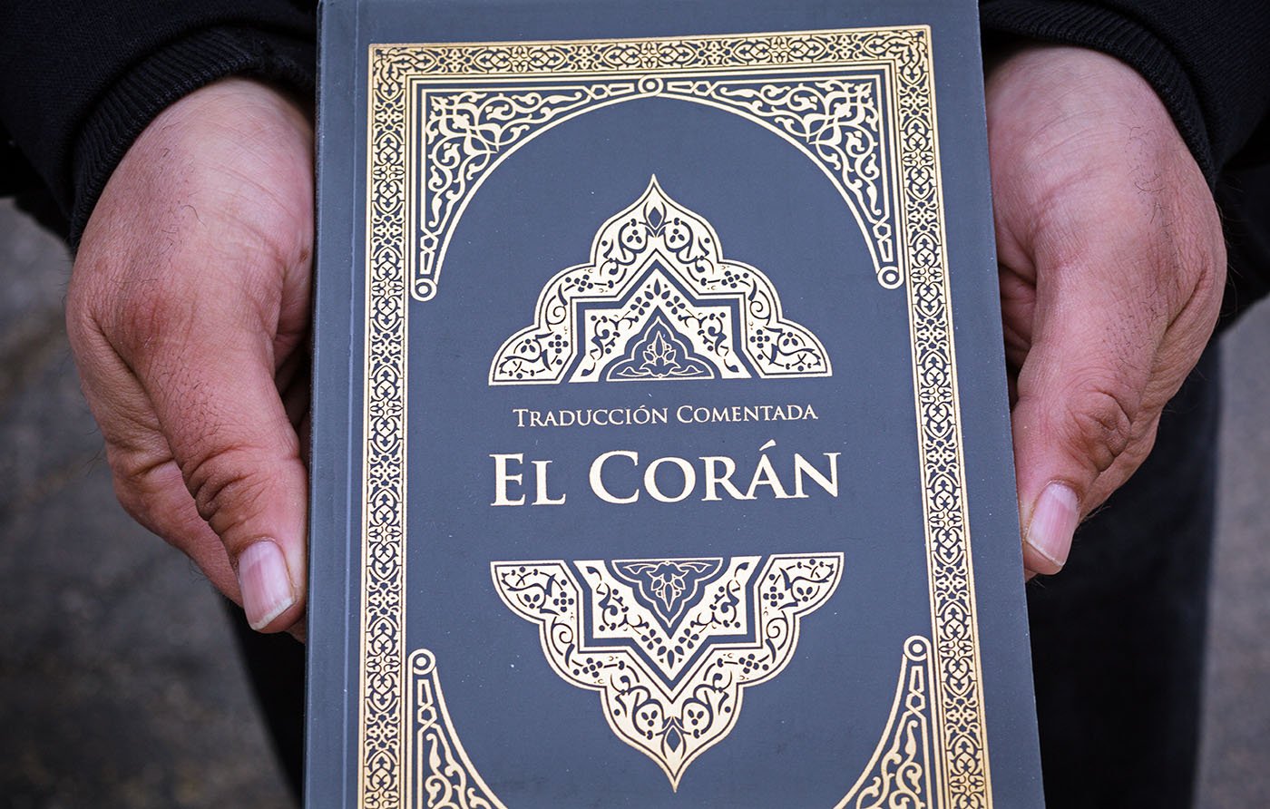 Raul Gonzalez holds a version of the Quran with Spanish translation in front of the Al-Nahda Center on March 14, 2021 in Worth, Ill.
