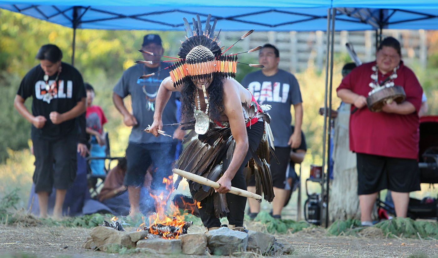  Vallejo, CA — Winnemem Wintu Michael Preston dances in front of the sacred fire as part of the Run4Salmon opening ceremony. September 9, 2017. Tom Levy/The Spiritual Edge 