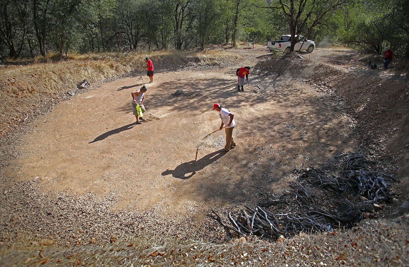  Redding, CA — Before a ceremony can begin, the space must be prepared for the dancers by clearing it of any rocks, pebbles or sticks. September 26, 2019. Tom Levy/The Spiritual Edge 