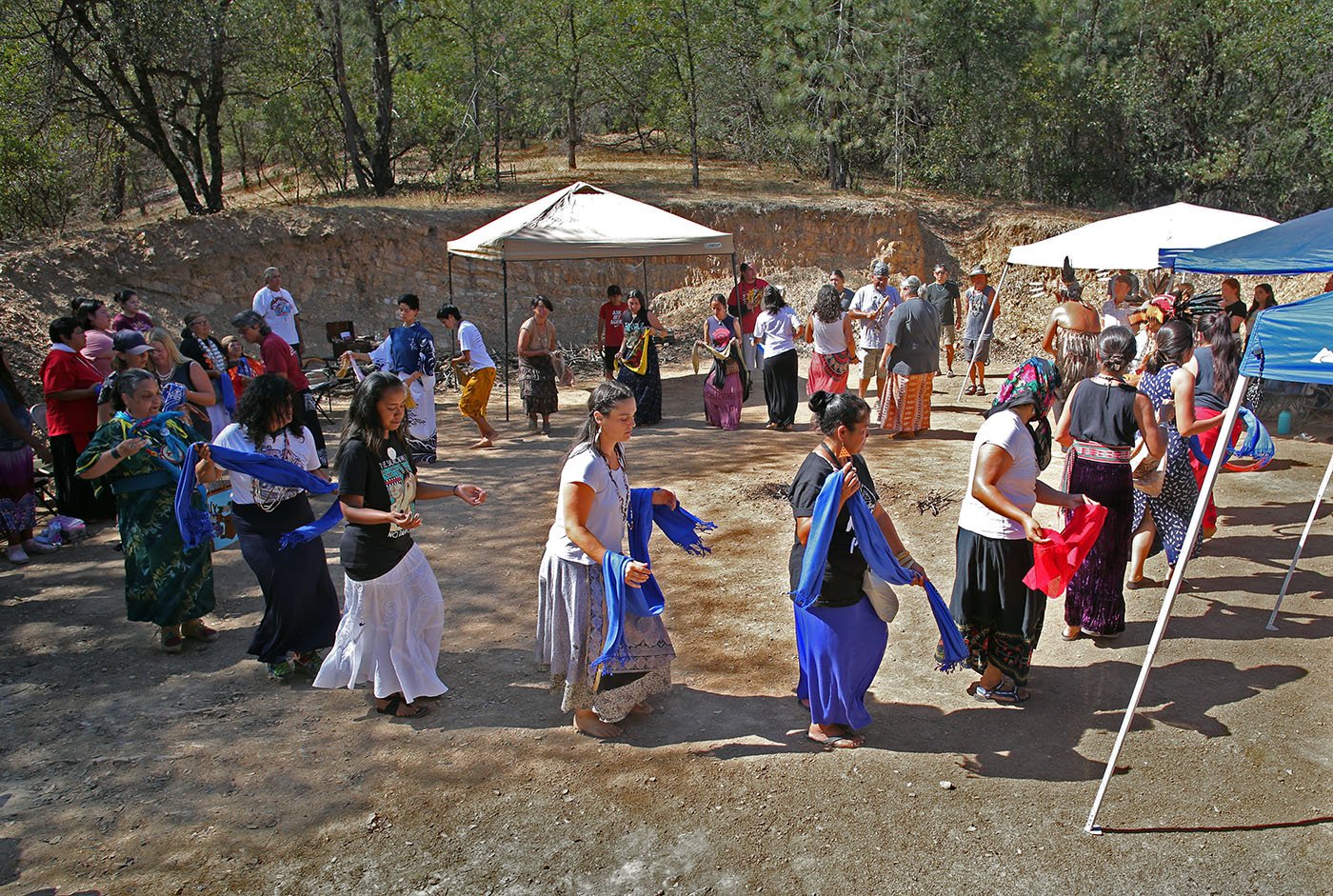  Redding, CA — Women dance on grounds that the Winnemem Wintu hope will become a roundhouse one day. It is part of a former Wintu village site. September 26, 2019. Tom Levy/The Spiritual Edge 