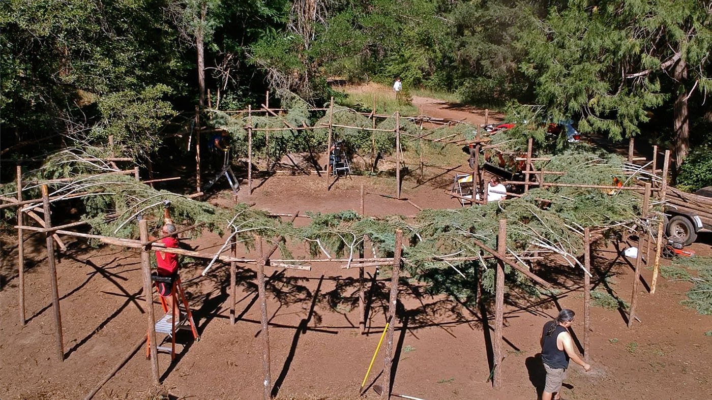  Shasta-Trinity National Forest — The Winnemem Wintu build a ceremonial arbor near the McCloud River waters where the winter-run Chinook salmon eggs will be released later that day. It was the first arbor built since private property owners and later