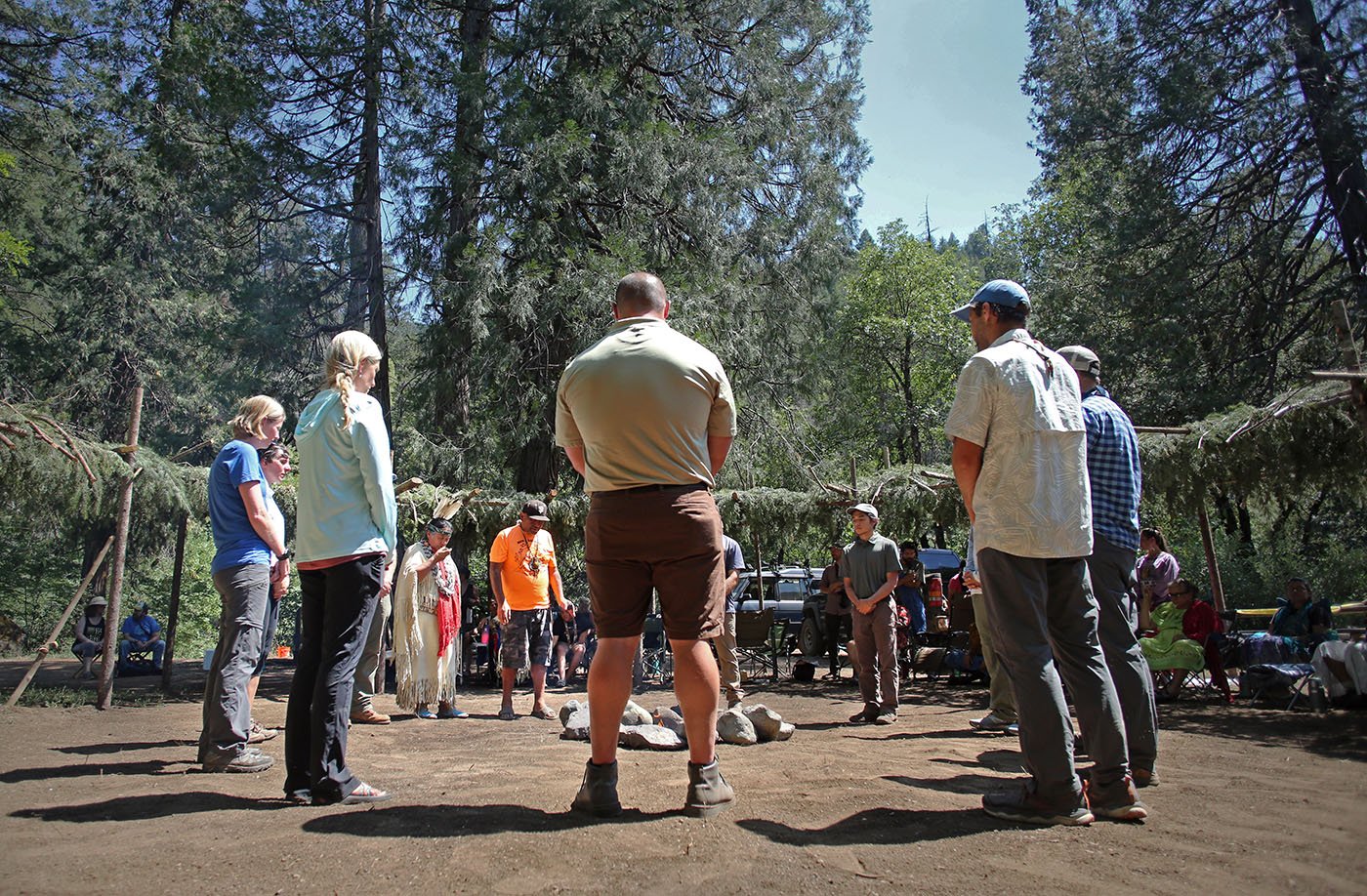  Shasta-Trinity National Forest — Federal and state scientists and administrators who worked on the winter-run reintroduction program stand in the middle of the ceremonial arbor. Several of them said placing winter-run eggs in the McCloud River incub