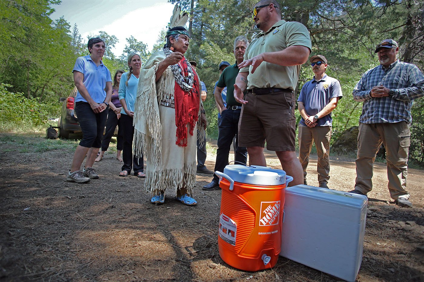  Shasta-Trinity National Forest — Hatcheries manager Taylor Lipscomb speaks with Winnemem Wintu Chief Caleen Sisk about logistics for transferring winter-run eggs into incubators. July 11, 2022. Tom Levy/The Spiritual Edge 