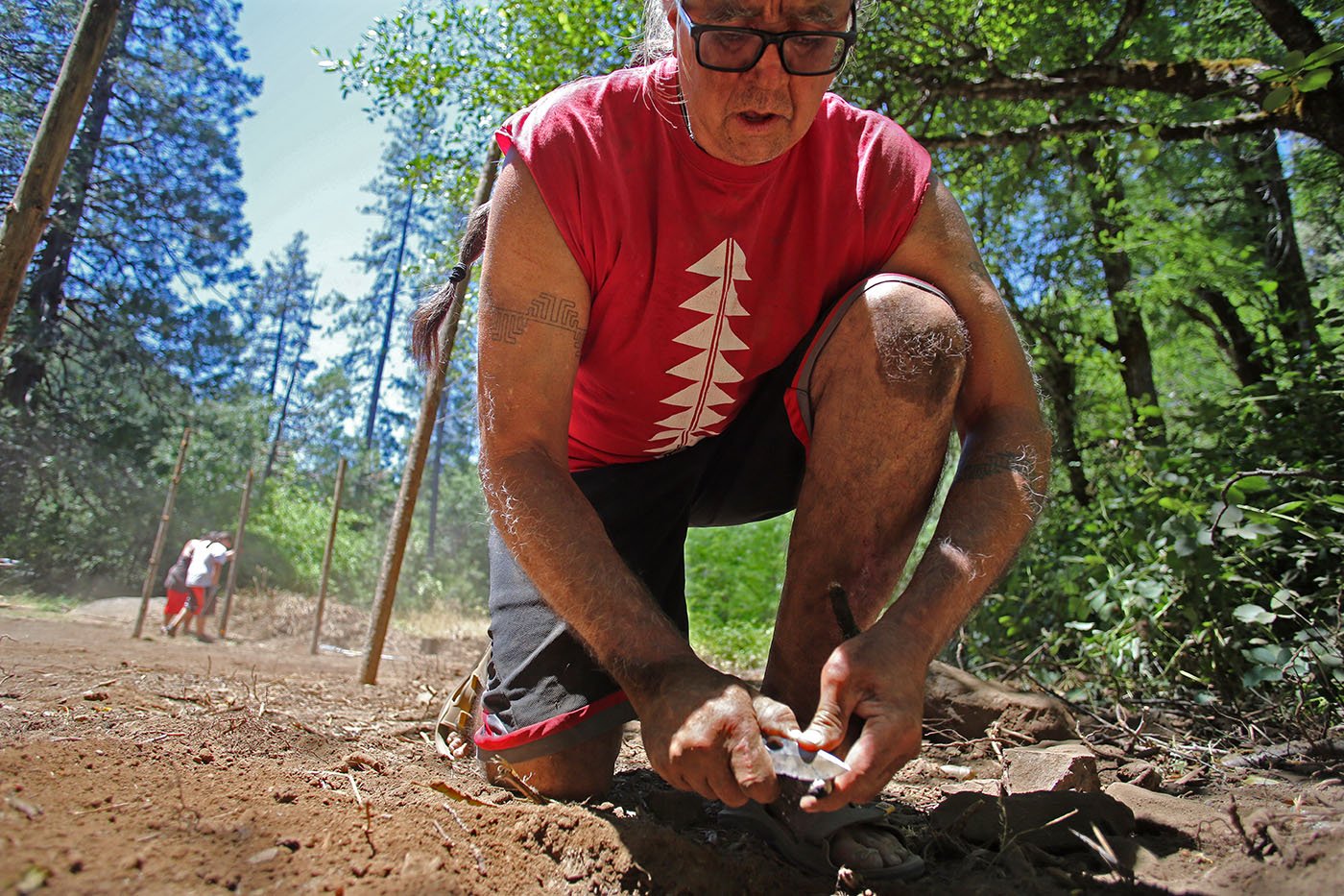  Shasta-Trinity National Forest — Dr. Dennie Schulteis helps with building of the arbor. A ceremony later in the day will welcome winter-run eggs before they are deposited in incubators on the McCloud River. July 11, 2022. Tom Levy/The Spiritual Edge