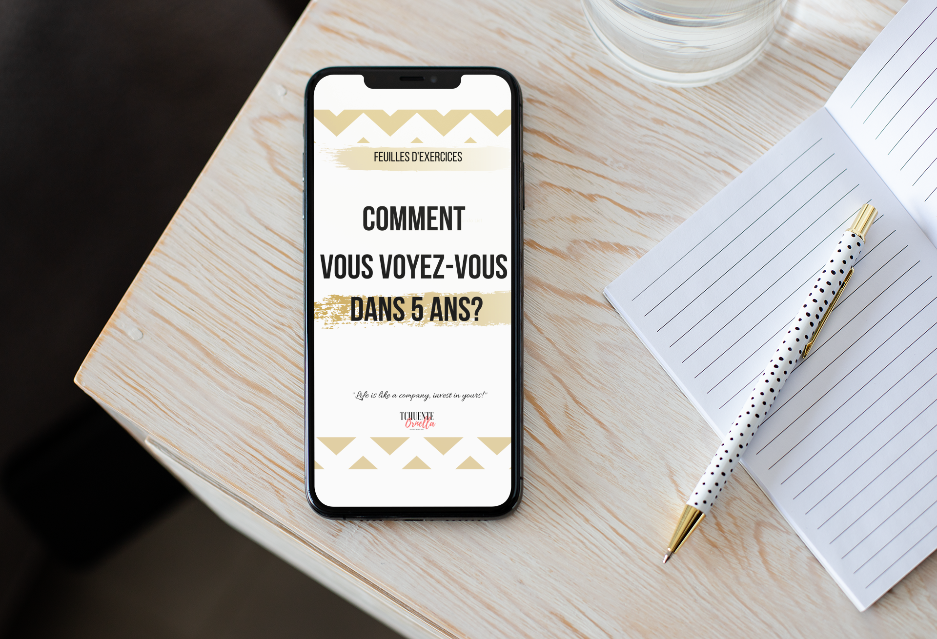iphone-xs-max-mockup-next-to-an-open-notebook-over-a-wooden-surface-25814.png