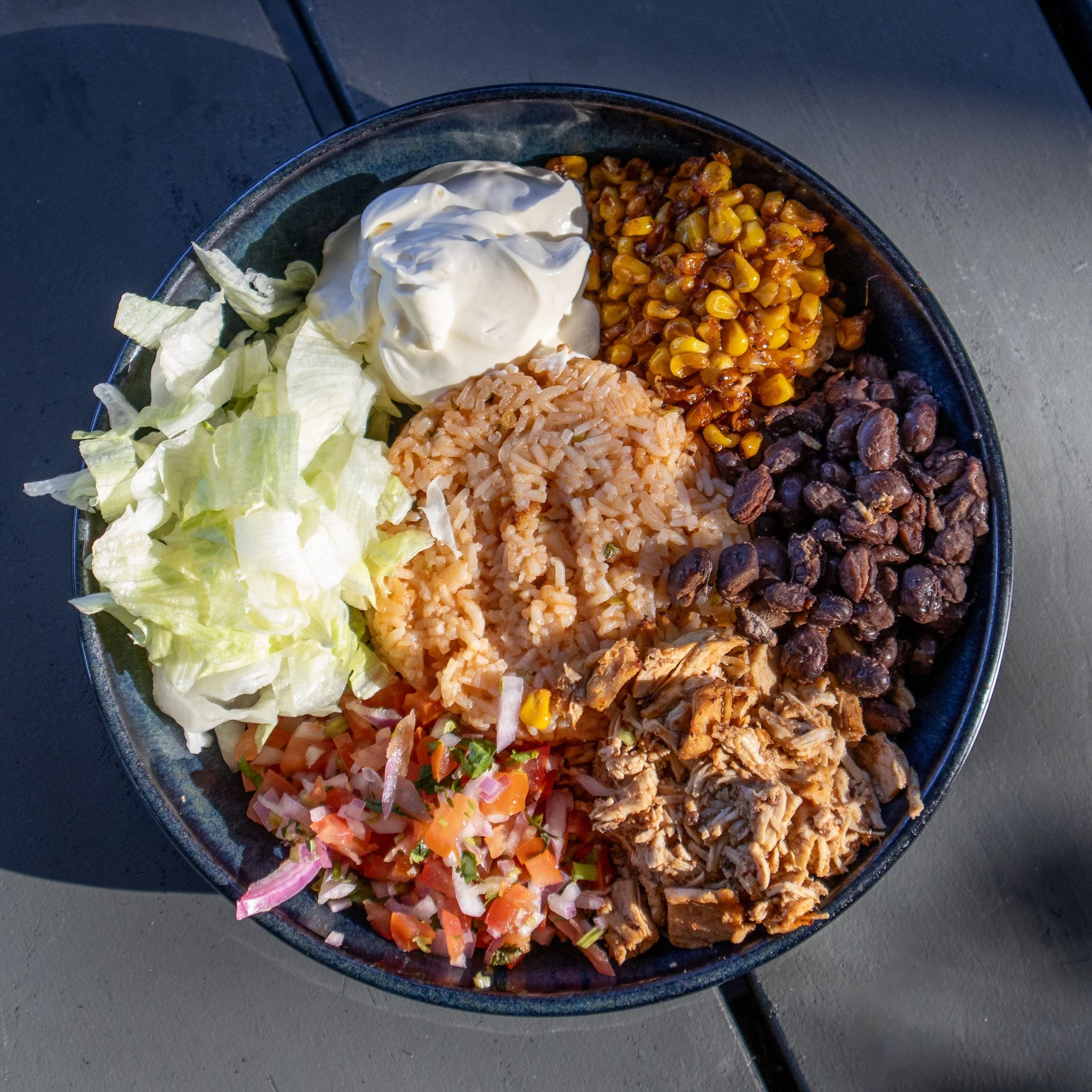 🌸 Fresh for spring! 🌿

Our Burrito Bowl is packed with Mexican-style chicken &amp; rice, shredded lettuce, charred corn, black beans, pico de gallo &amp; sour cream. Plus, it&rsquo;s gluten free 👏

Come try it for yourself on your next visit! 🌞