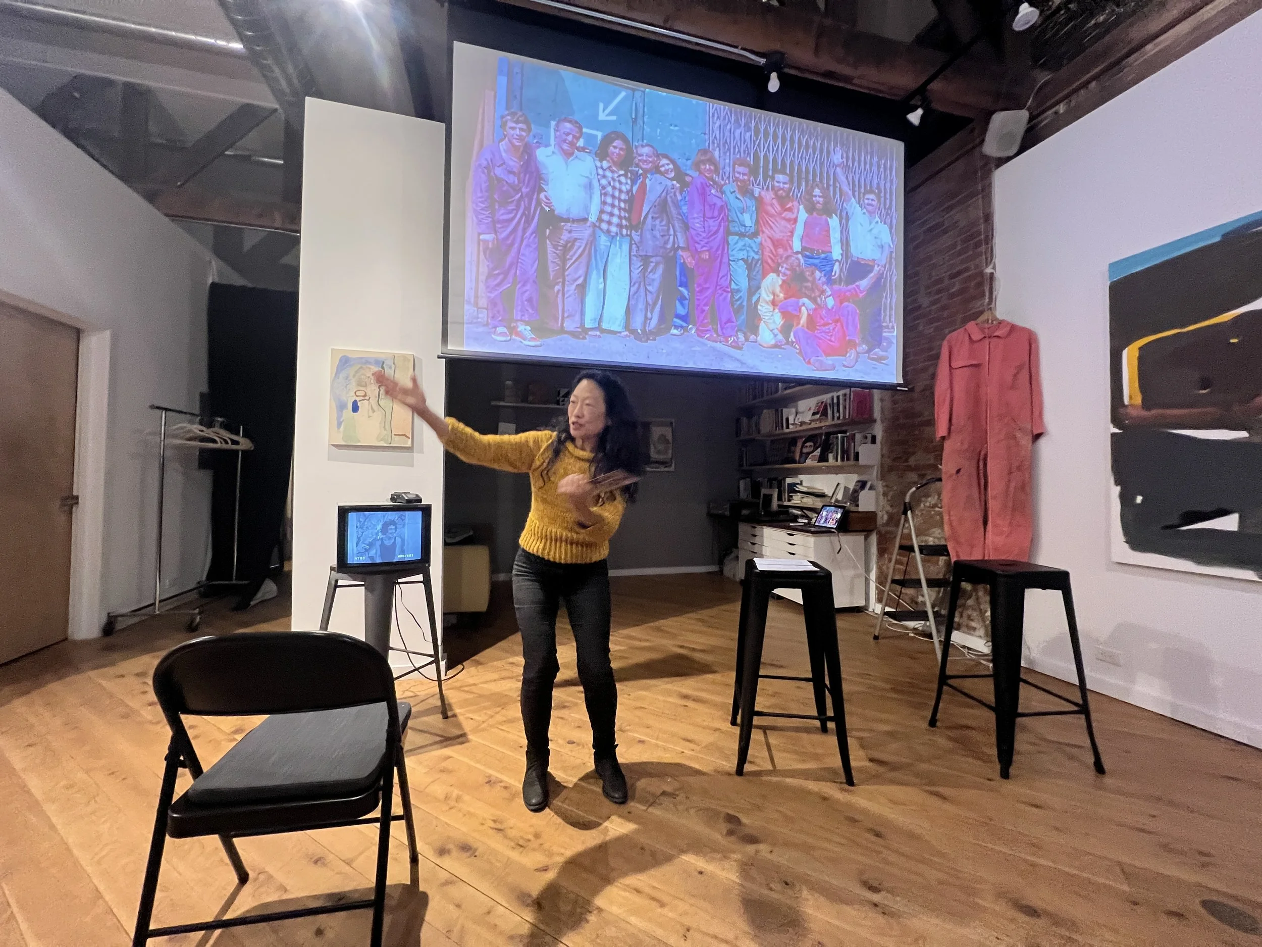 Mina Takahashi introducing the evening event at Bushel Collective, BRIDGING 1977/2026 with John Halpern and Carolyn Christie-Irvine