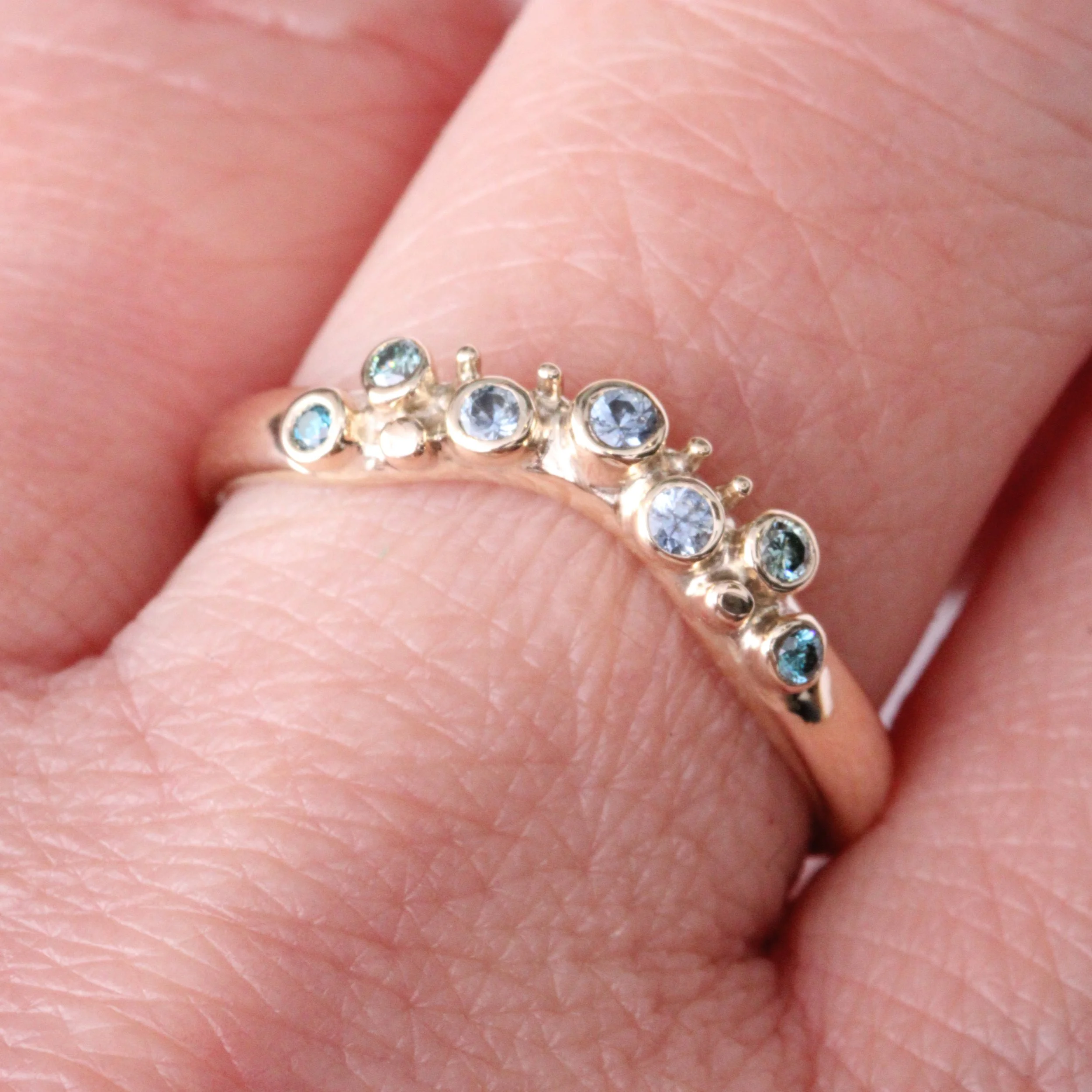 9Y Denim Sapphires Blue and Teal Diamonds hand.jpg