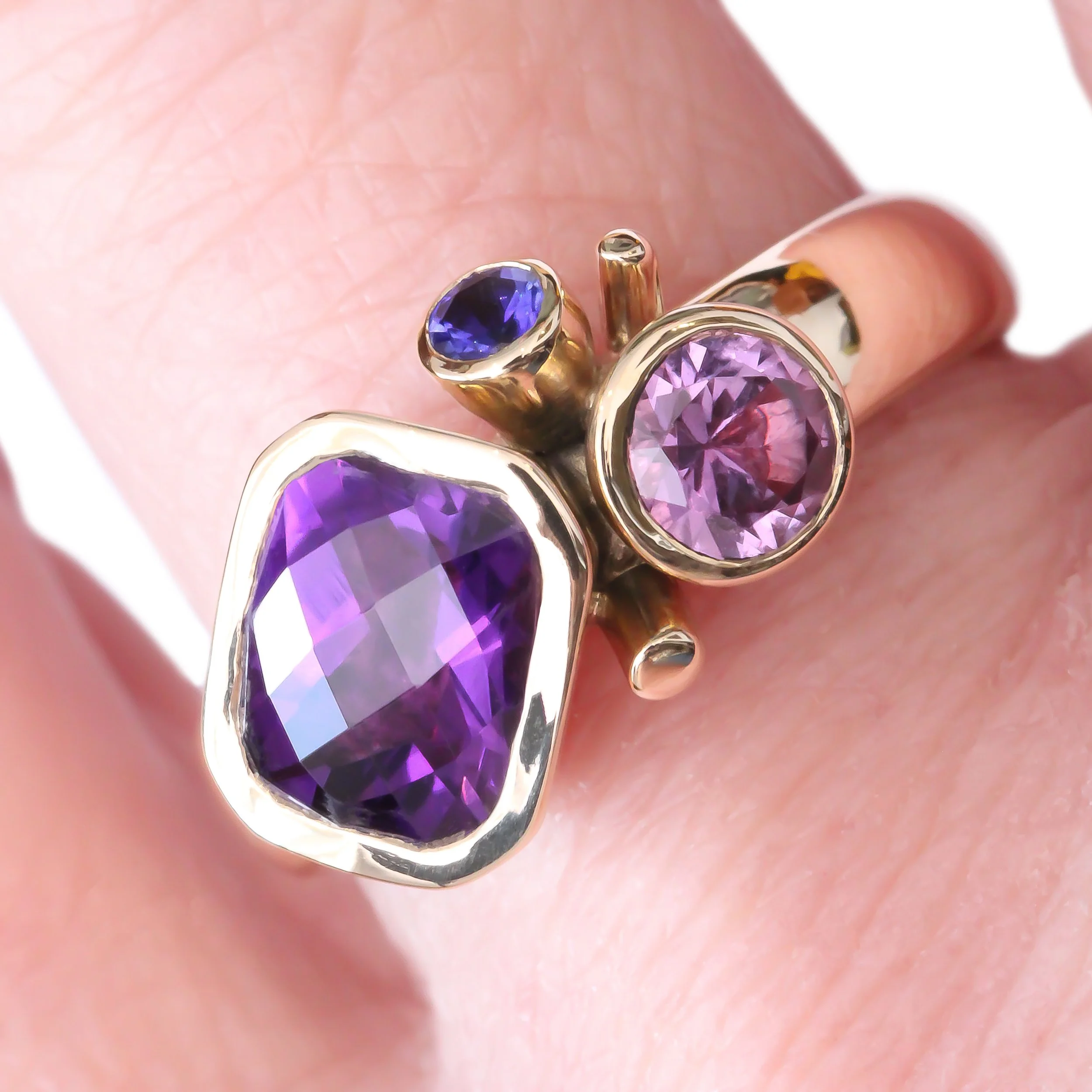 9Y Check Amethyst, Purple Sapphire & Tanzanite - hand.jpg