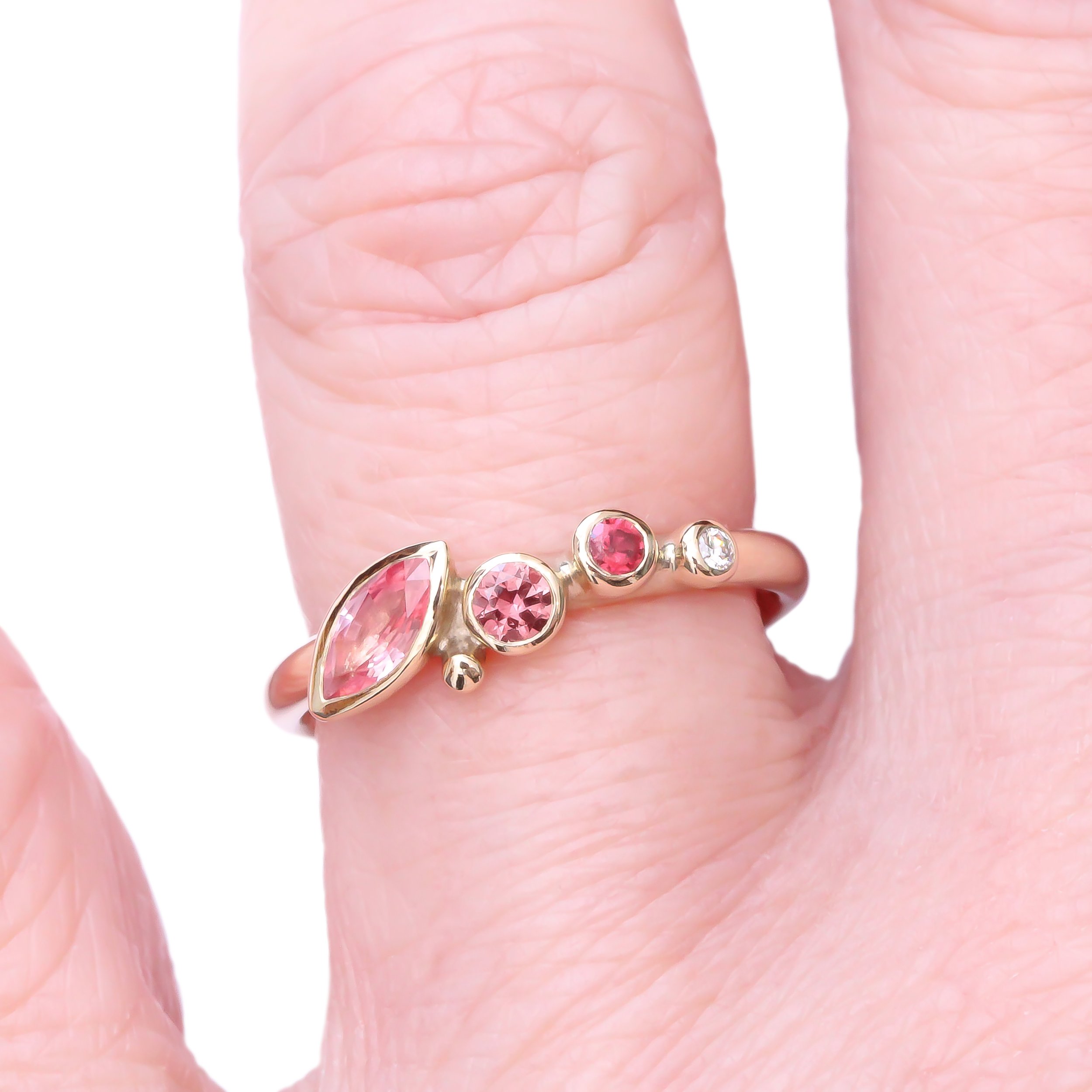 9Y Padparadscha Sapphire Marquise - hand.jpg