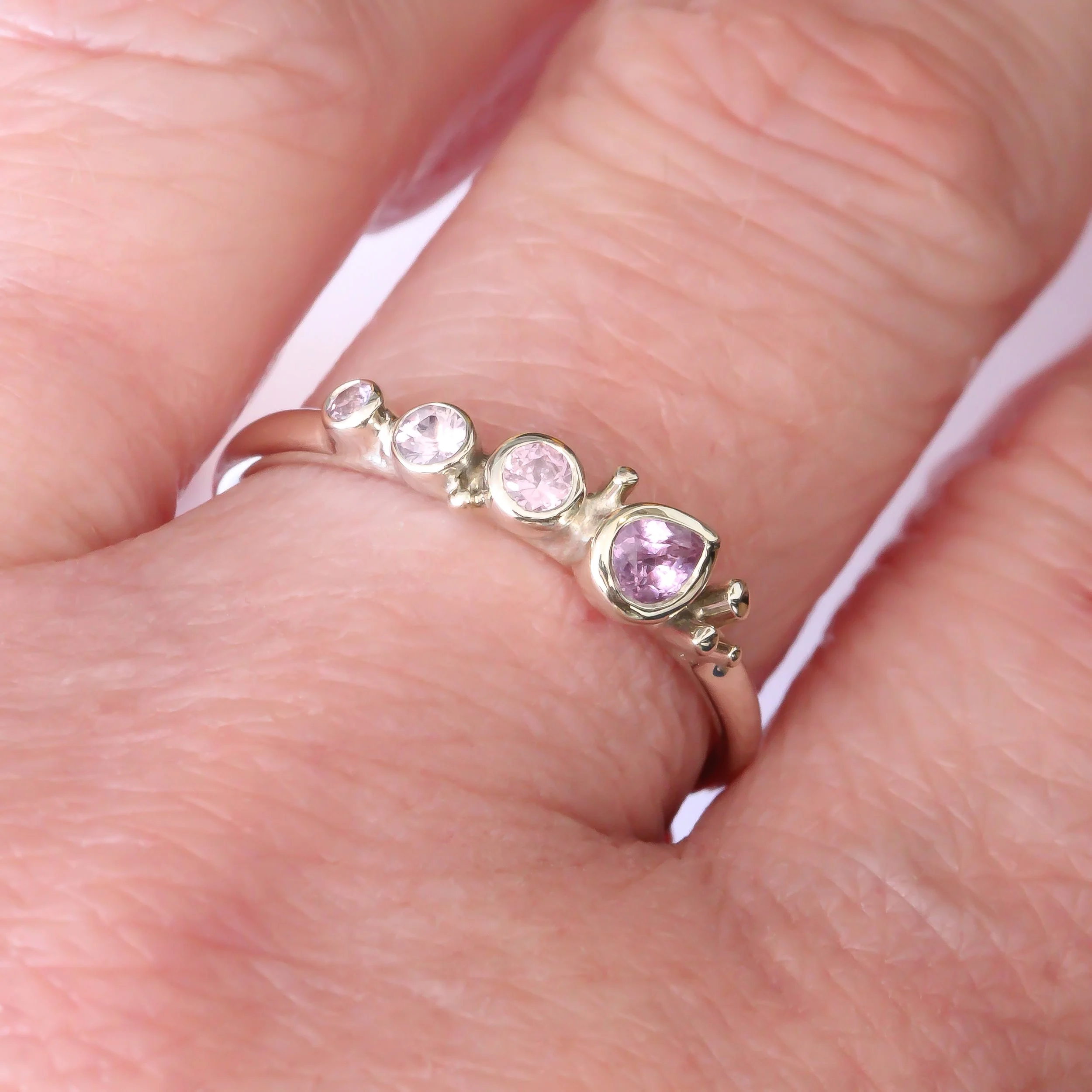 9W Pink Sapphires - hand.jpg