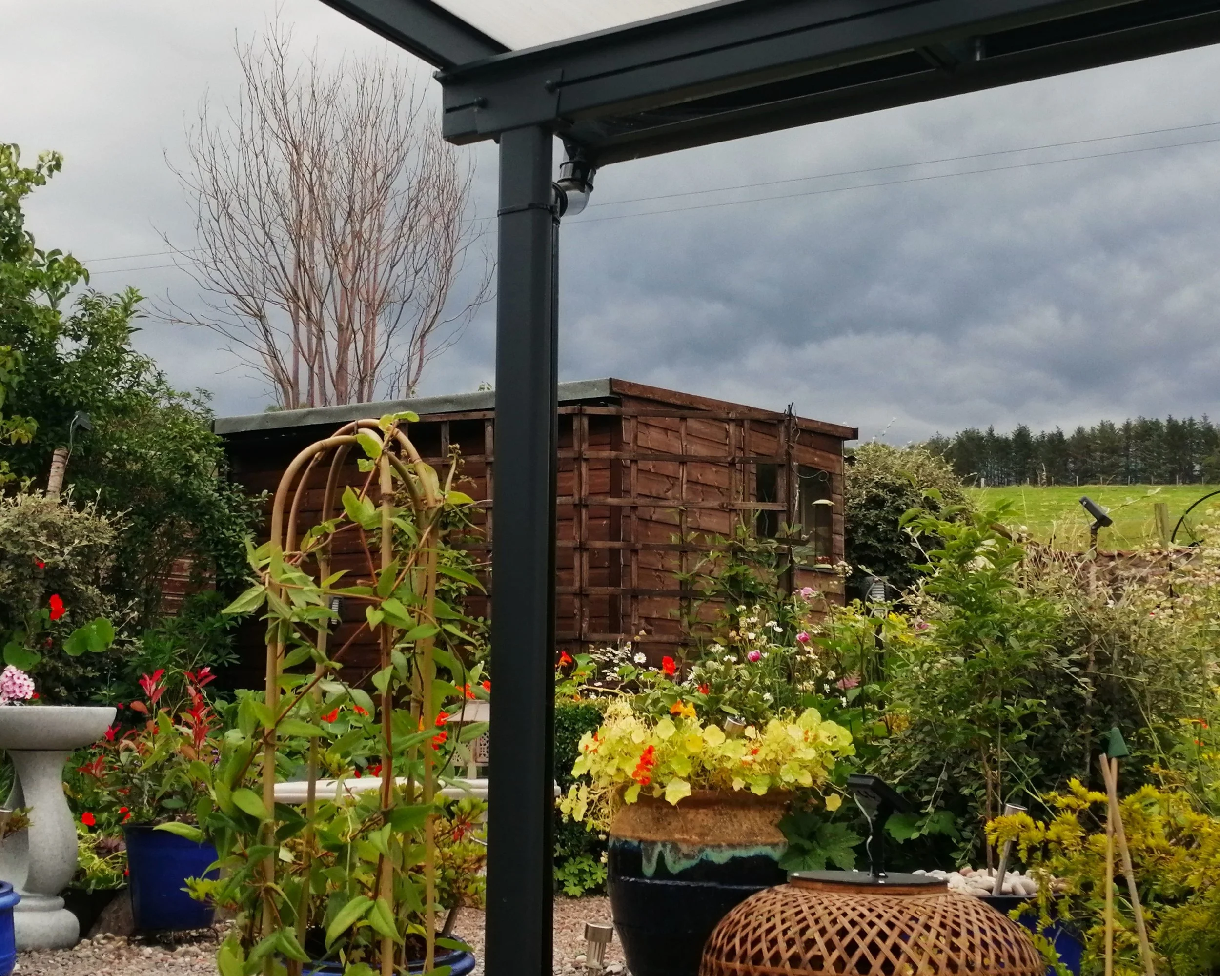 Dining under the porch, waiting for the storm