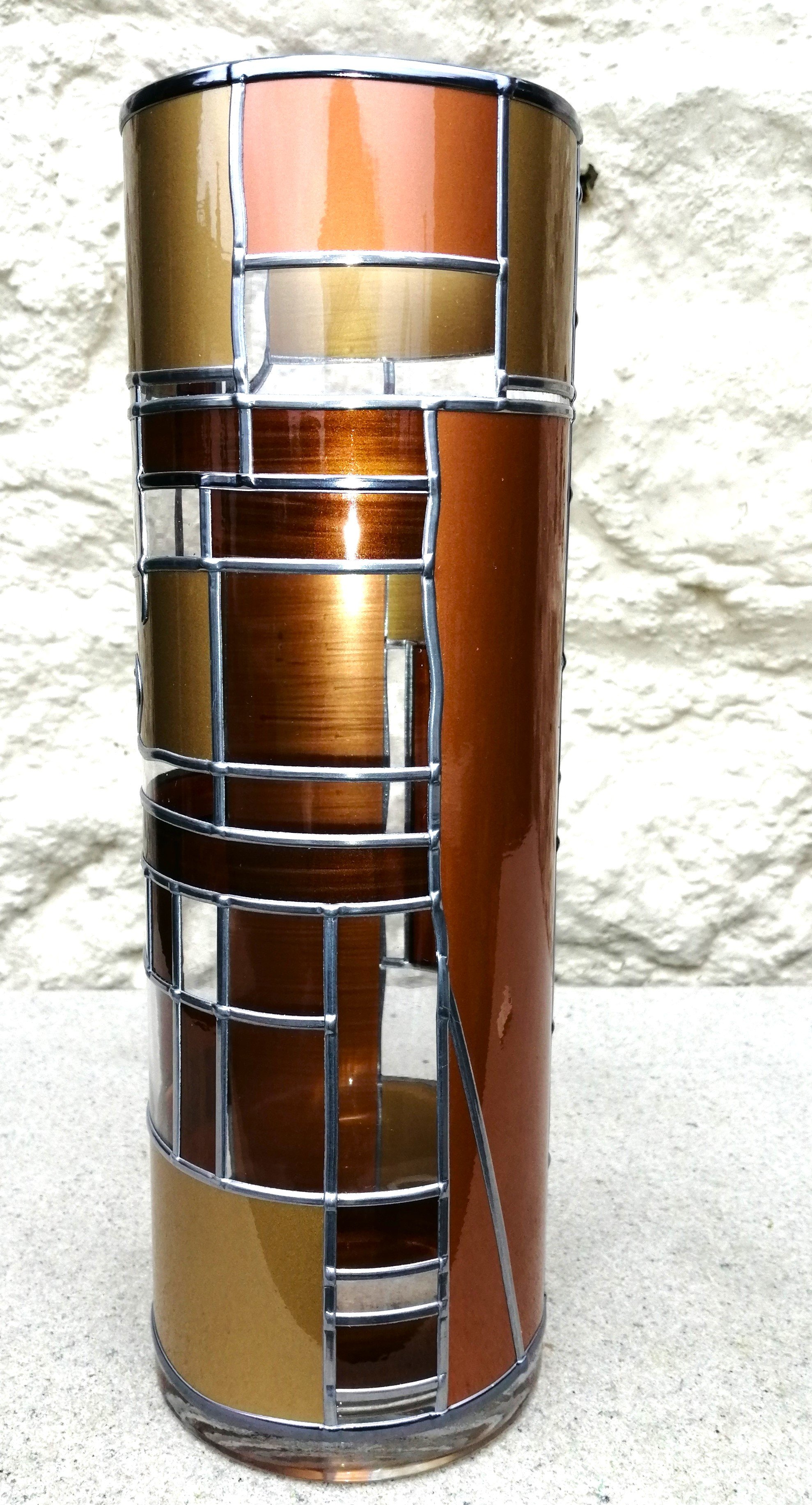 Oric is an Art Deco-Stained Glass Effect Flower Vase with a leaded design in shades of bronze, gold and mahogany.