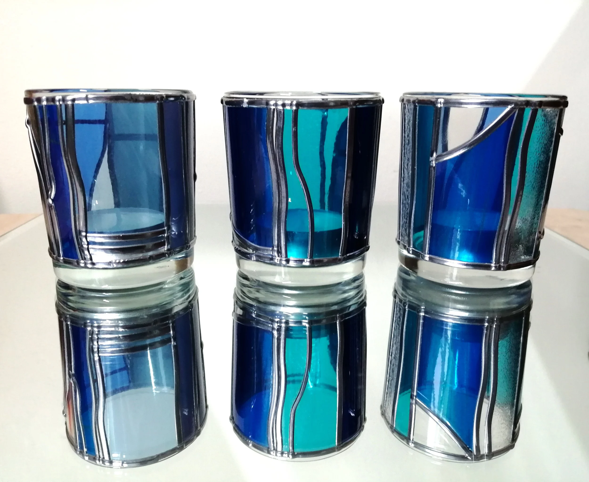 Set B  is a set of stained glass effect candle holders