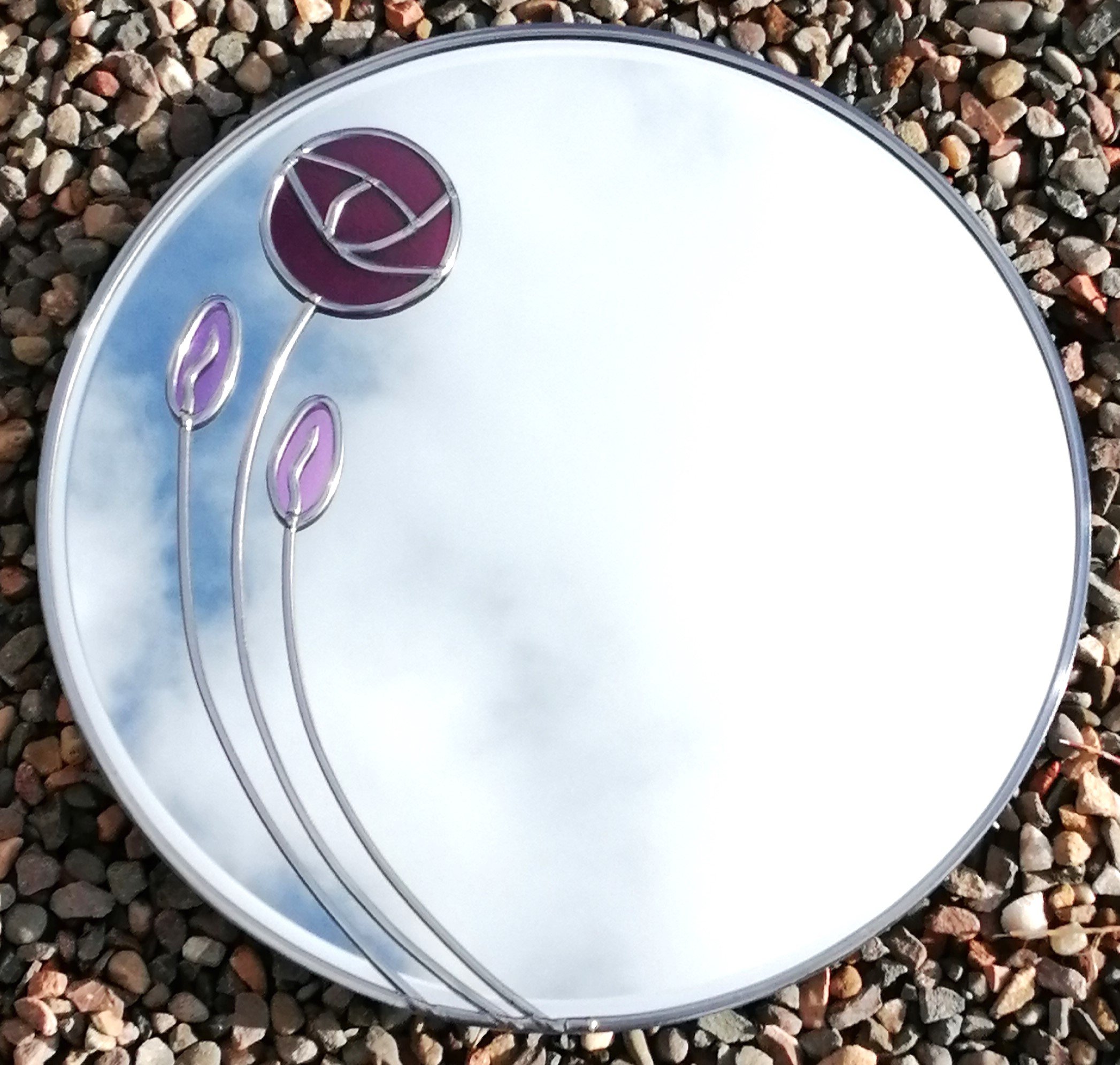 Signature Rose is a Mackintosh-inspired stained Glass Wall Mirror 30 cm Round in Plum and lilac.