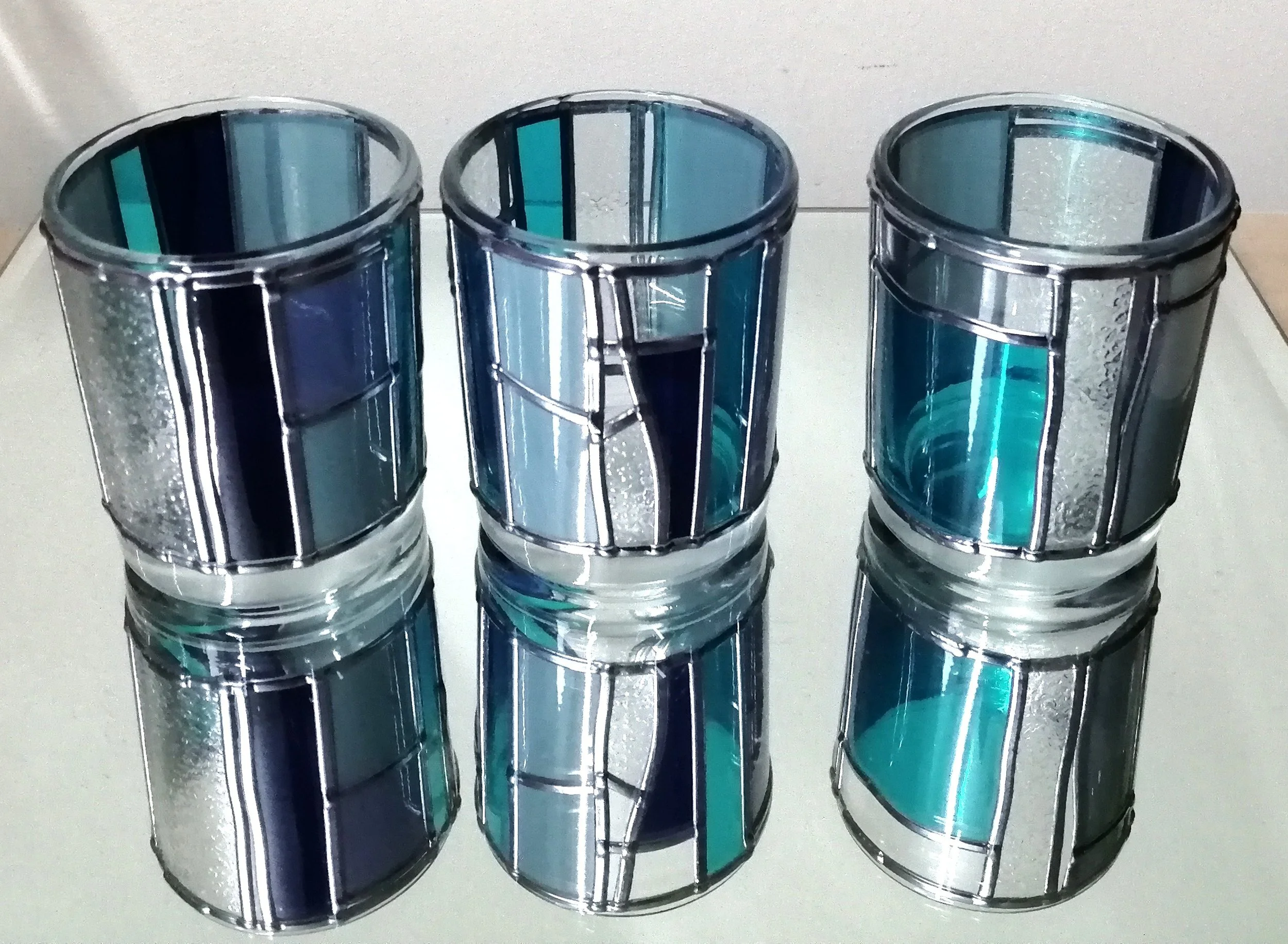 Set B  is a set of stained glass effect candle holders
