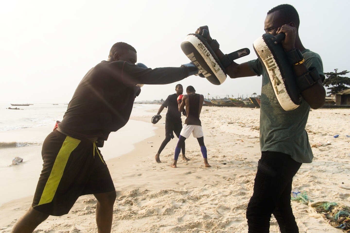 11/13 &quot;Two weeks ago I was walking with my family on the beach, and as every time I go out without my camera, an interesting situation appeared, a group of young people training MMA on the beach with a beautiful sunset behind. 
Two weeks later, 