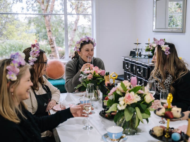 Image 2 - A group of smiling women at a flower crown class.jpg
