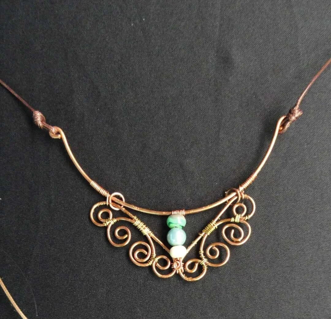 Copper necklace with 3 blue stones