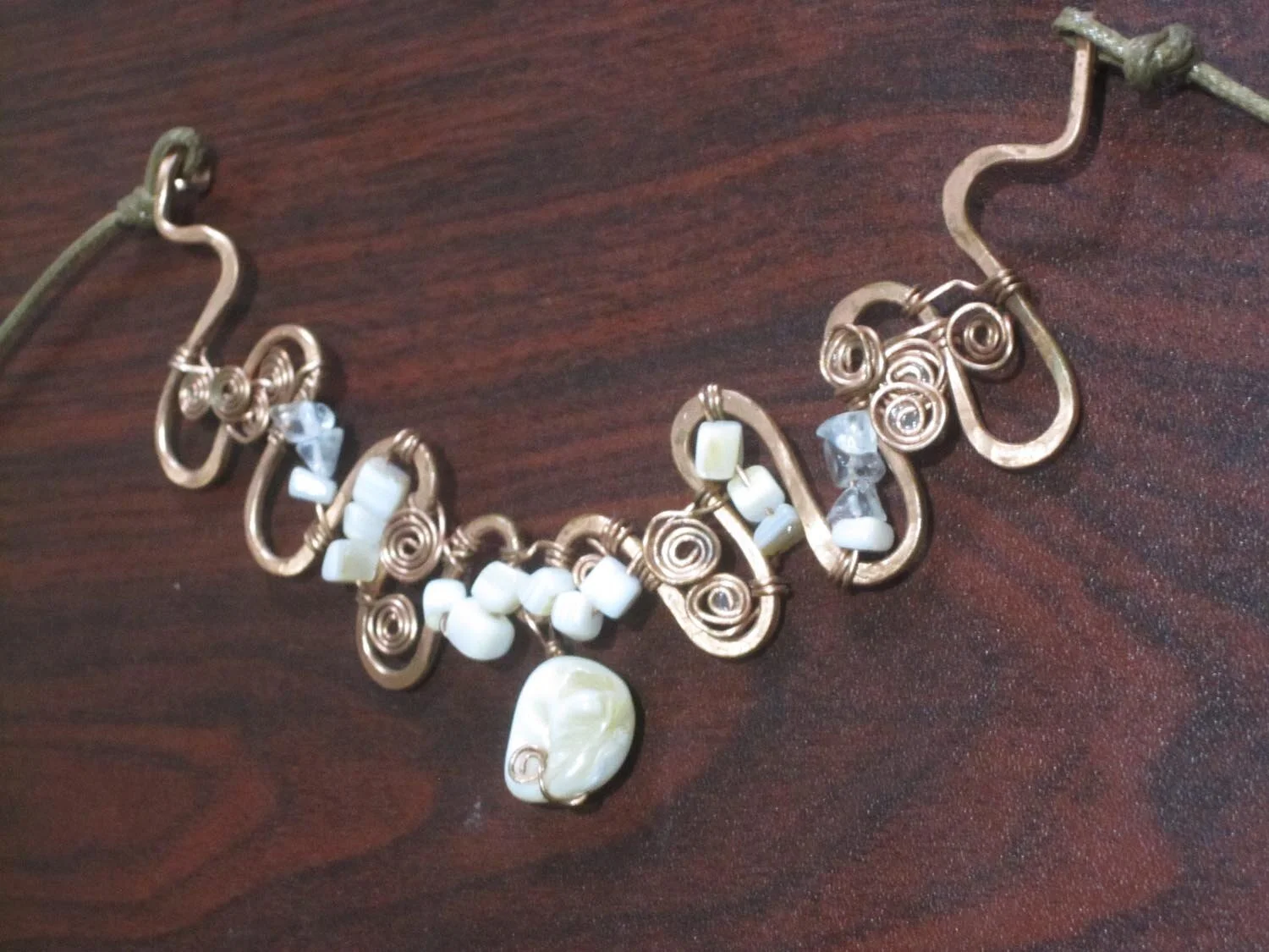 Copper necklace with white and transparent stones