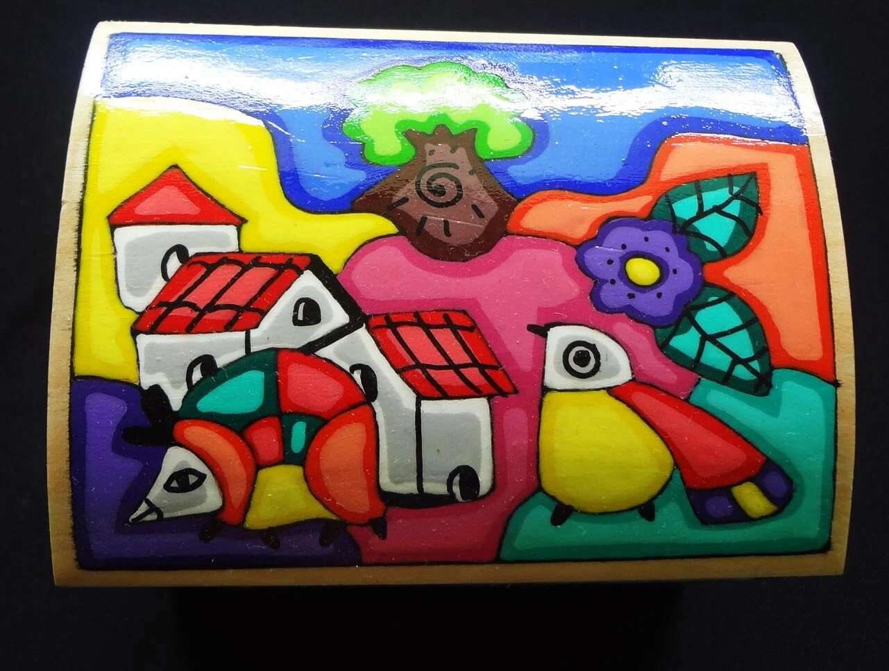 Set of wooden boxes with carved house design