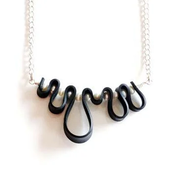 Necklaces with wire made from recycled bicycle tires