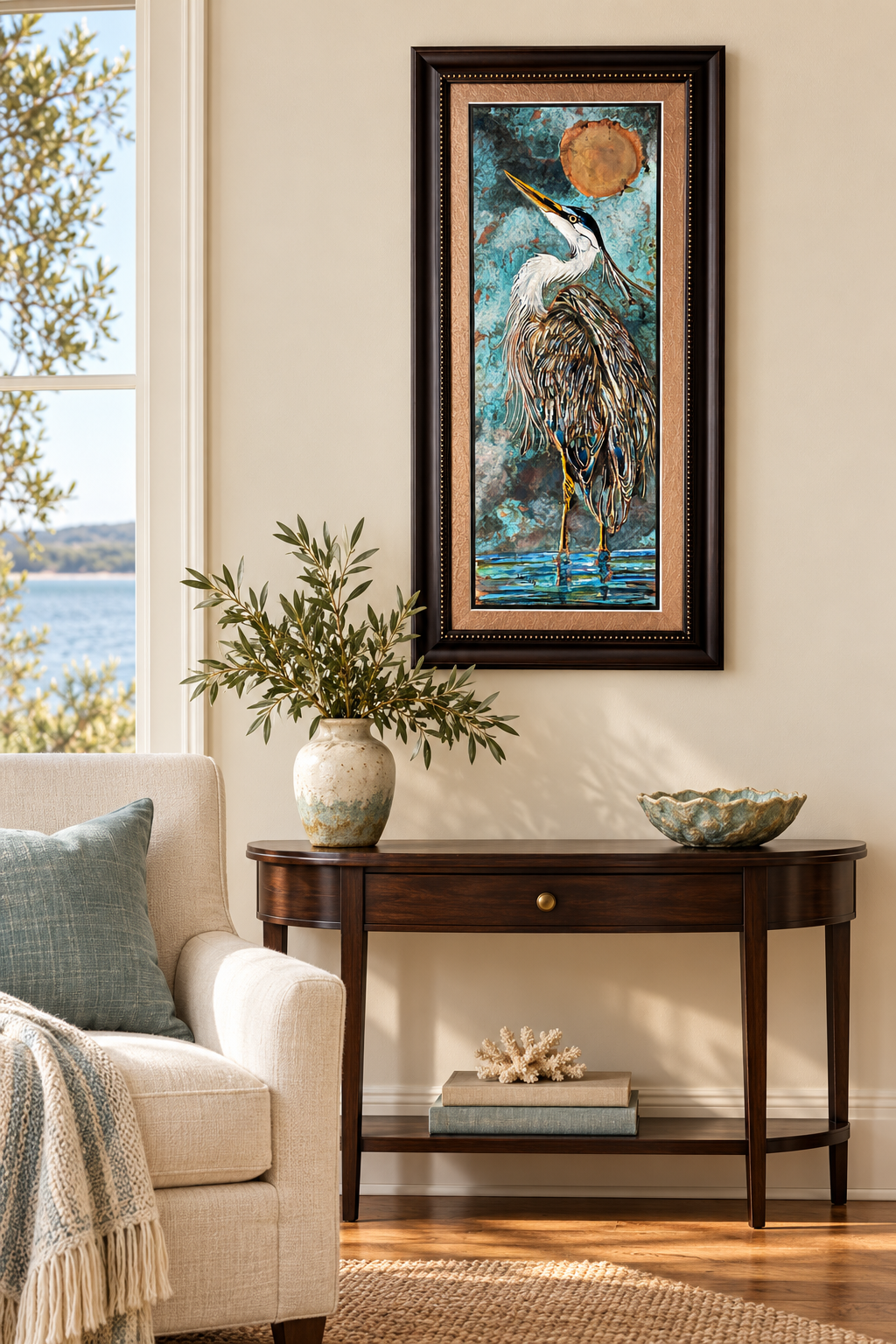 Framed heron above a walnut console.png